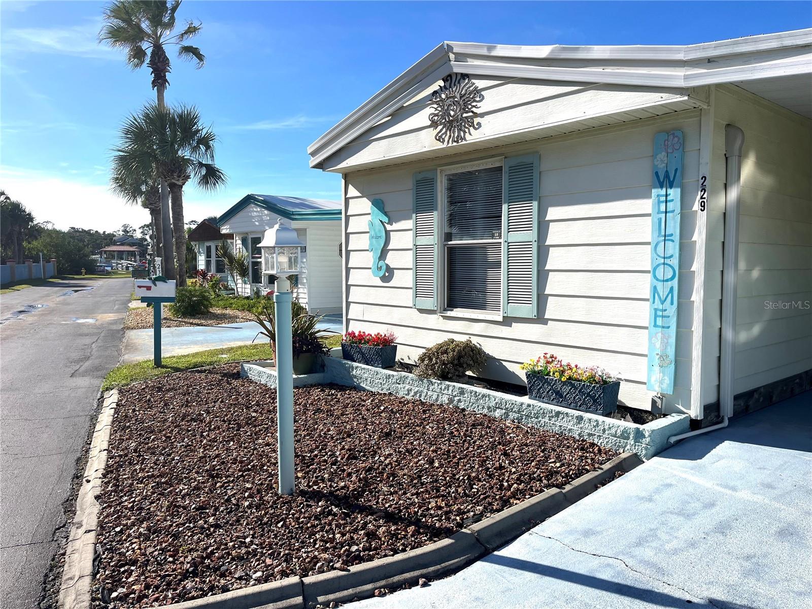 If you are looking for a winter get-away or full time residence at the beach this might be the one for you! This cute, cozy home is so bright and airy and it has had some recent updates; Mitsubishi Mini Split A/C units (4) installed in 2019, new roof in 2022, and new kitchen with all new stainless steel appliance, granite counters, soft close cabinets and luxury plank flooring in kitchen and living room in 2023. New stack washer/dryer, beautiful walk in shower and toilets also in 2023. Open floor plan with split bedrooms for extra privacy for your guests. It also has a large Florida Room that is heated and cooled giving you extra square footage for entertaining. Located in Surfside Estates, an active 55+ Manufactured Home Community that is nestled between the Atlantic Ocean and the Intracoastal Waterway. Surfside Estates is a Resident Owned land share Community which means there is no lot rent! When you purchase your home in Surfside Estates you own a share of this beautiful beachside community. The monthly maintenance fee is $220/month and includes wi-fi, internet, cable, yard maintenance, management and use of all the facilities. There is an inground heated/cooled pool, fitness room, library, shuffleboard court and rooftop deck. The Social Club offers many activities to get involved as much or as little as you like. Friday night bingo, men's and lady's cards, pool tables and large screen TV for all your sporting events. Exercise classes and water aerobics. Walk to the beach across the street or ride your bike or golf cart to one of the 2 docks to enjoy fishing or just relax and enjoy the sunsets and the boats and dolphins go by. There is kayak storage, a BBQ Pit and gazebo with a view of the Intracoastal. The quaint neighboring town of Flagler Beach is just a few minutes down the road, where you will find a variety of shops and restaurants to choose from. Just over the bridge you will find shopping, restaurants, hospitals and doctors. What are you waiting for? Time to get out of the cold and start enjoying your own piece a paradise today!