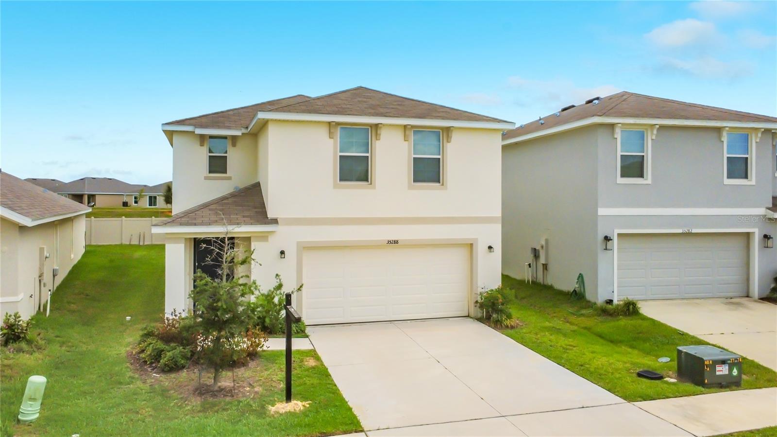 Welcome to this 4 Beds, 2.5 Bath, 2 Car Garage in the desirable Summit View Subdivision in Dade City offering the perfect blend of style, comfort, and functionality.
The Exterior of this house is entirely concrete block and it offers a spacious , modern layout. 
As you come in, the first floor has an open concept that welcomes and ushers you into the Living room and the Kitchen which features Stainless Steel Appliances, Sizeable Pantry , Sytlish Cabinents and Countertops that overlooks the living and dining areas. This first level has a convenient powder room or half bath, Storage Closets, with tile throughout. The Sliding gives you access to the patio and a big Yard for memorable outdoor Living and moments. Upstairs, you have the Primary Bedroom / Owner's Suite , Walk in Closet, three other bedrooms with Closets and a Versatile Loft. 
The Community - SUMMIT VIEW have a Resort-Style Pool, Cabana, Two Pickleball Courts, Tot Lot / Playgound and Half Basket Ball Court.
Enjoy the peaceful, elevated setting with rolling hill views combined with easy access to major roads,  highways and historic downtown Dade City, local farms, St Leo University, schools, USF and commuting routes toward the greater Tampa Bay area.
Move in Ready. Seller is motivated. Schedule Showing Today !