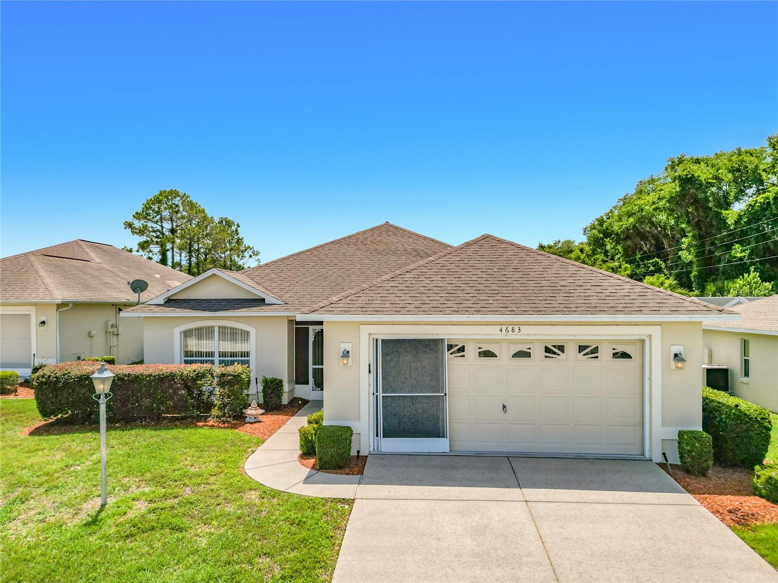 BRAND NEW ROOF COMING PRIOR TO CLOSING. Charming and move-in ready home is located in the sought-after 55+ lakefront gated community of Arbor Lakes. Featuring 2 bedrooms plus an office, 2 bathrooms, and a 2-car garage. This inviting residence offers wonderful curb appeal with mature landscaping, an extended driveway, and a cozy front porch. Inside, the open and airy floor plan is designed for both comfortable everyday living and easy entertaining, with a spacious living and dining room combination that flows seamlessly into the kitchen. The eat-in kitchen offers generous counter space, ample cabinetry, additional bar seating, and sliding glass doors that open to the screened lanai, creating the perfect indoor-outdoor setting for relaxing or enjoying your morning coffee. The spacious primary suite provides a private retreat with a walk-in closet and an en-suite bath featuring dual sinks and a tiled shower. A split-bedroom layout places the secondary bedroom and full bath on the opposite side of the home, offering added privacy for guests or family. With its functional layout, inviting living spaces, and desirable location in Arbor Lakes, this home is ready for you to move in and enjoy. Additional features include AC 2017 and garage door in 2013. HOA fees include Cable/Internet, Garbage Service, Lawn Service, Exterior Paint, Irrigation & Pest control. Arbor Lakes features lots of activities & amenities to keep you going: Fishing pier, boat ramp on Lake Tsala Apopka (community only), nature trail, tennis court, shuffleboard, boat/RV storage, clubhouse, swimming pool, and more. You won't be bored here! The Hernando chain of lakes features some of the best fishing in FL and nearby you will find plenty of outdoor activities from hiking & biking trails to great kayaking areas. Short drive to the extended Suncoast Parkway. The city of Hernando is a short distance from it all; shopping, restaurants, healthcare, hospitals, and gas stations are all close by. Ocala 25 miles, Crystal River is 15 miles, Tampa/Orlando can be reached in just over an hour. Don't miss the chance to experience the Florida lifestyle at its finest in Arbor Lakes!
