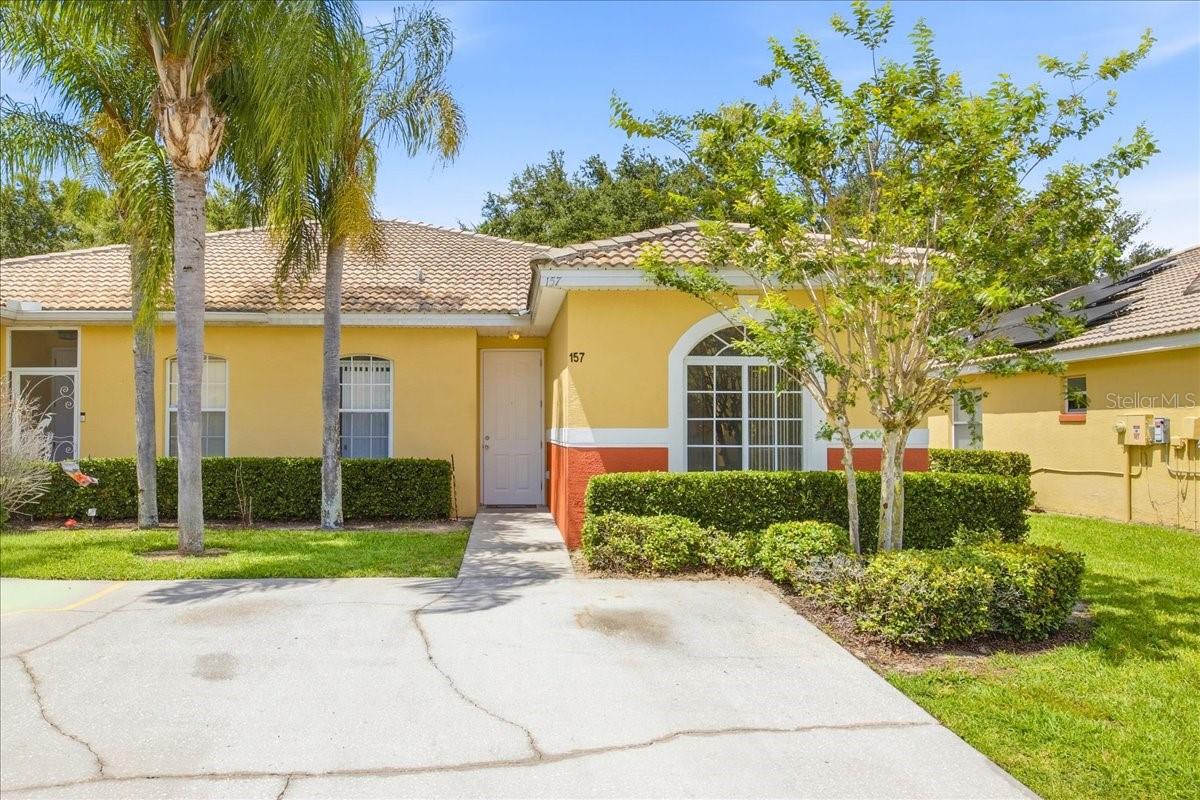 Come enjoy this beautiful 3-bedroom, 2-bath condo villa located in the gated community of Lake Marion Resort. This inviting home features an open-concept layout. The kitchen with a breakfast bar overlooking the living room, creating a bright and functional living space. Step outside to a spacious covered lanai with views of a lush green patio area, perfect for relaxing and enjoying Florida's beautiful weather. The primary suite offers a private bathroom with 2 sinks, a separate shower and a garden tub, while the two additional bedrooms and a full bath are conveniently located off the foyer, providing privacy and comfort for family or guests. Recent improvements include fresh interior paint (2026), a new A/C system (2024), and a new water heater (2025). The home also features ceramic tile throughout the main living areas and attractive laminate flooring in all bedrooms. Whether you're looking for a primary residence, vacation getaway, or investment opportunity, this well-maintained villa offers comfort, convenience, and resort-style living. Long & Short Term rental allowed. The Lake Marion Creek Community amenities include 24/7 gated security, clubhouse with fitness center, two pools, BBQ and picnic areas, playground, basketball and tennis courts, and a gazebo. HOA fees cover security, lawn care, irrigation, cable service, exterior painting, and maintenance of community amenities. Conveniently located near Legoland, Disney, shopping, dining, and Florida's beautiful beaches. Enjoy resort-style living year-round in this outstanding community. Don't miss this opportunity! Schedule your private showing today before it's gone.