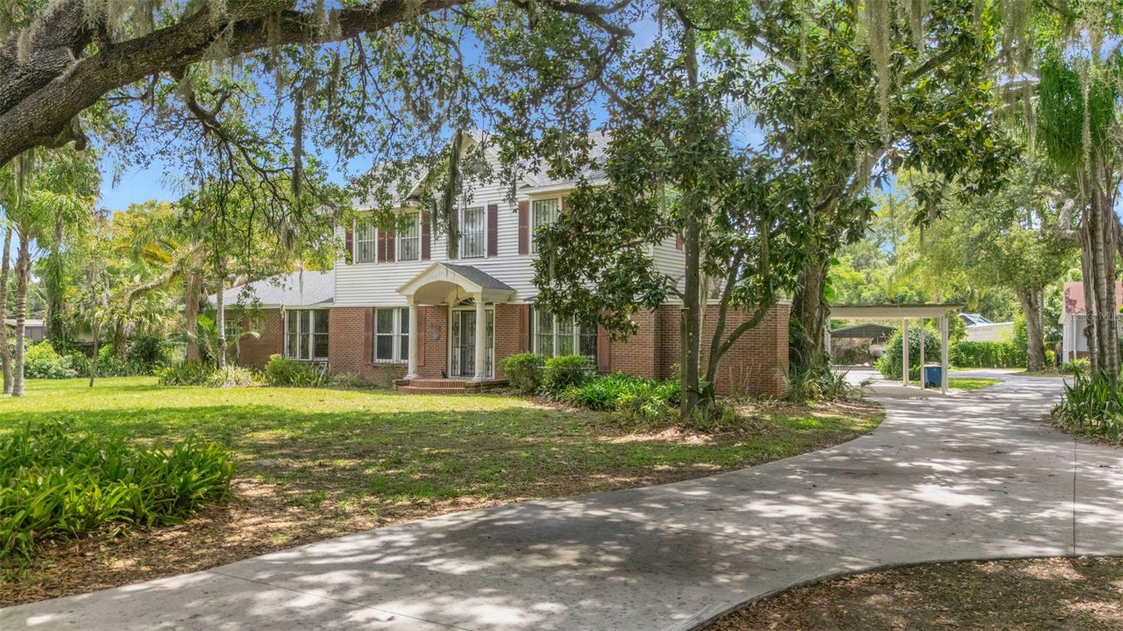 STEP BACK IN TIME . . . . own a part of Bartow’s history is steeped into every room of this 1910 home situated on nearly a full acre in the heart of Bartow’s residential area just a few blocks east of the courthouse and south of Main Street.  This sprawling 5-bedroom, 4-bath home features spacious rooms throughout, a dedicated office, formal living and dining rooms, family room, and a Florida room complete with Terrazzo flooring and REAL cypress paneled walls and built-in bookcase.  There are a multitude of built-in features throughout the home, storage space galore (every inch was utilized!), a non-working fireplace (it was capped years ago), PLUS a 1-bedroom / 1-bath cottage/guest house with kitchen and living area that was completely updated in 2022.  There is also a detached 2-car garage with workshop space, two storage sheds and a covered space for boat/RV parking.  The inground pool is situated away from the main residence and cottage.  Shingle roof replaced in 2022, tented in 2022 and comes with the balance of Orkin’s 5-Year Warranty.  Main sewer line replaced in 2020.  Please do not rely on public records for SF figures as a recent appraisal determined the Main house is approximately 4067 SF of living area and detached Cottage/Guest House is approximately 693 SF of living area.  This home is being sold AS-IS ONLY - No Exceptions!   And don’t miss the Estate Sale being held from June 25th through June 28th hosted by Cheek House Estate Sales.  Interior photos will not be available until after the conclusion of the estate sale and the home has been cleared of unsold items and professionally cleaned.