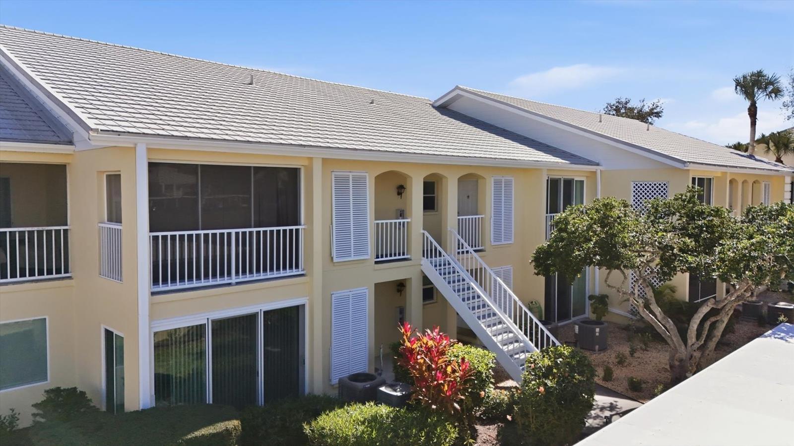 Virtually Staged. SELLER WELCOMES ALL REASONABLE OFFERS. Beautifully situated in the heart of Venice’s sought-after Plantation Golf & Country Club, this second-story 2-bedroom, 2-bath residence offers 1,100 square feet of comfortable, low-maintenance living paired with serene golf course views. Step out onto the spacious screened lanai overlooking the lush fairways—an ideal spot to enjoy morning coffee or unwind in the evening while taking in the peaceful surroundings.
Inside, the home features a thoughtfully updated kitchen with solid surface countertops, a new refrigerator and microwave, and updates completed approximately six years ago. Both bathrooms have also been updated, creating a clean, modern feel throughout. Additional peace of mind comes with a new roof (2025) and the convenience of a dedicated carport.
Residents enjoy access to a community pool along with optional memberships to have access to Plantation’s impressive resort-style amenities, including two 18-hole championship golf courses, 13 tennis courts, 6 pickleball courts, bocce ball, a fitness center, and a junior Olympic-sized pool. Multiple on-site dining options, including a popular grill room, and a full calendar of social events coordinated by an activities director create an active, engaging lifestyle.
Ideally located less than 3 miles from Wellen Park, under 5 miles from Cool Today Park, and just 15 minutes from the sugar-sand beaches of Manasota Beach.  This condo offers exceptional value with no CDD fees. Whether you’re searching for a full-time residence, seasonal escape, or investment opportunity, this golf course-view condo delivers the best of Florida living.