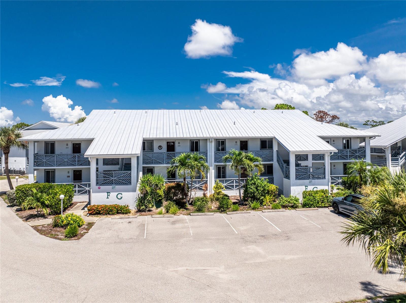 Welcome to the maintenance free community of Fiddler's Green, located just minutes from Boca Grande and Manasota Key. This mostly furnished FIRST FLOOR condo features a brand new HVAC (2025) and has been impeccably maintained. The kitchen boasts updated wide plank tile floors, neutral colored appliances that have all been recently replaced, ample counter space and cabinetry with a closet pantry, and additional space for a work or crafting area with the washer/dryer closet nearby. The dining and living room have been updated with laminate wood-look flooring with plenty of space for your family and friends to sit and gather. Expand your living space outdoors to your private, screened lanai with tile flooring, a ceiling fan, and a roomy outdoor storage closet. Back inside the desirable floor plan offers space for you and your guests. The primary suite has a spacious bedroom with quality carpeting, sliding glass doors out to the lanai, a sizable walk-in closet, and an ensuite bath with wood cabinets, diagonal tile flooring, and an updated shower with floor to ceiling tiled walls. The guest bedroom has carpeting, a walk-in closet, and ensuite bathroom with wood cabinets, an updated lighted vanity mirror, and a shower/tub that will suit all your guests needs. Enjoy the location of this unit, just a short walk to the community pool and other amenities including tennis & pickleball courts, shuffleboard, and let's not forget the social activities where you can stay active and get to know your neighbors. Fiddler's Green is centrally located just minutes from multiple beaches, shopping, restaurants, a multitude of golf courses, fishing, walking trails, and SO much more. This can be your tropical paradise, schedule your showing today.