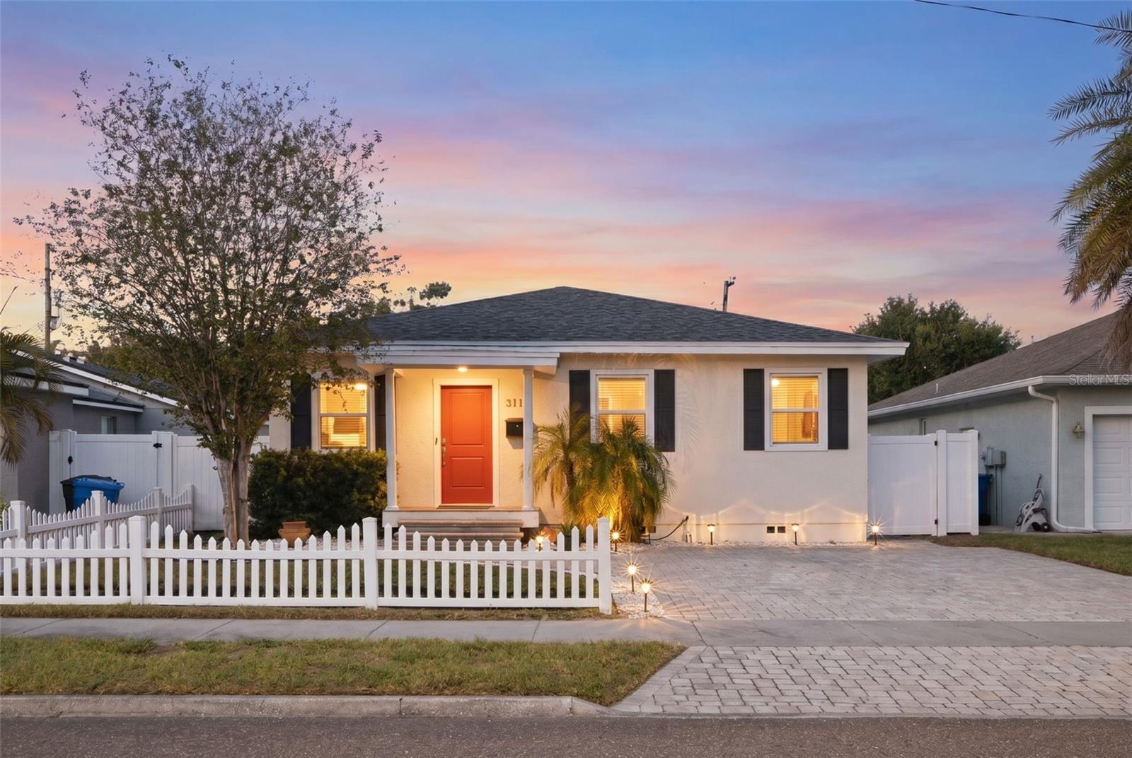 COMPLETELY RENOVATED 3BED/2BATH IN MAGNOLIA HEIGHTS | 2025 ROOF | TURNKEY READY
Welcome home to one of St. Pete's most sought-after north side neighborhoods, where tree-lined streets, a tight-knit community feel, and quick access to top schools, local dining, and downtown make every day feel like you chose exactly right.

This completely transformed 3-bedroom home delivers new construction quality without the new construction price tag. The infrastructure is already done: a brand-new roof installed November 2025, whole-home water filtration, updated electrical and plumbing, and a Vivint smart security system. Move in and focus on living, not worrying.
Step past the white picket fence onto a sleek paver driveway and into a home that genuinely impresses. The open-concept chef's kitchen is the heart of it all, with granite countertops, a breakfast bar ideal for morning routines or evening catch-ups, and modern appliances that flow into a dedicated laundry and pantry area with wood counters and custom floating shelves. Whether it's Sunday brunch or a weeknight dinner party, this space works.
High ceilings and a custom wood-panel accent wall give the living room a designer edge, while glass sliding doors open to a fully fenced backyard built for both relaxing and gathering. The large deck is perfect for weekend cookouts, morning coffee, or winding down after a long week, and a storage shed keeps bikes, gear, and outdoor essentials neatly tucked away. The corner lot gives you breathing room without an overwhelming yard to maintain.
The primary suite is a genuine retreat with dual walk-in closets, private deck access via glass sliders, and a spa-style ensuite featuring a frameless walk-in rain shower. Two additional bedrooms, each with walk-in closets, offer real flexibility as a home office, guest room, or room to grow.
Throughout the home, laminate and tile flooring, stone counters in every bathroom, crown molding, and built-in details reflect thoughtful design at every turn. The covered front porch rounds out a home that's as welcoming as the neighborhood around it.
The property can be sold fully furnished for a truly seamless move-in experience.
Magnolia Heights is the kind of neighborhood where neighbors know each other, local spots are walkable, and you're minutes from everything St. Pete has to offer without sacrificing the calm of a well-established residential street.
Schedule your private showing today.