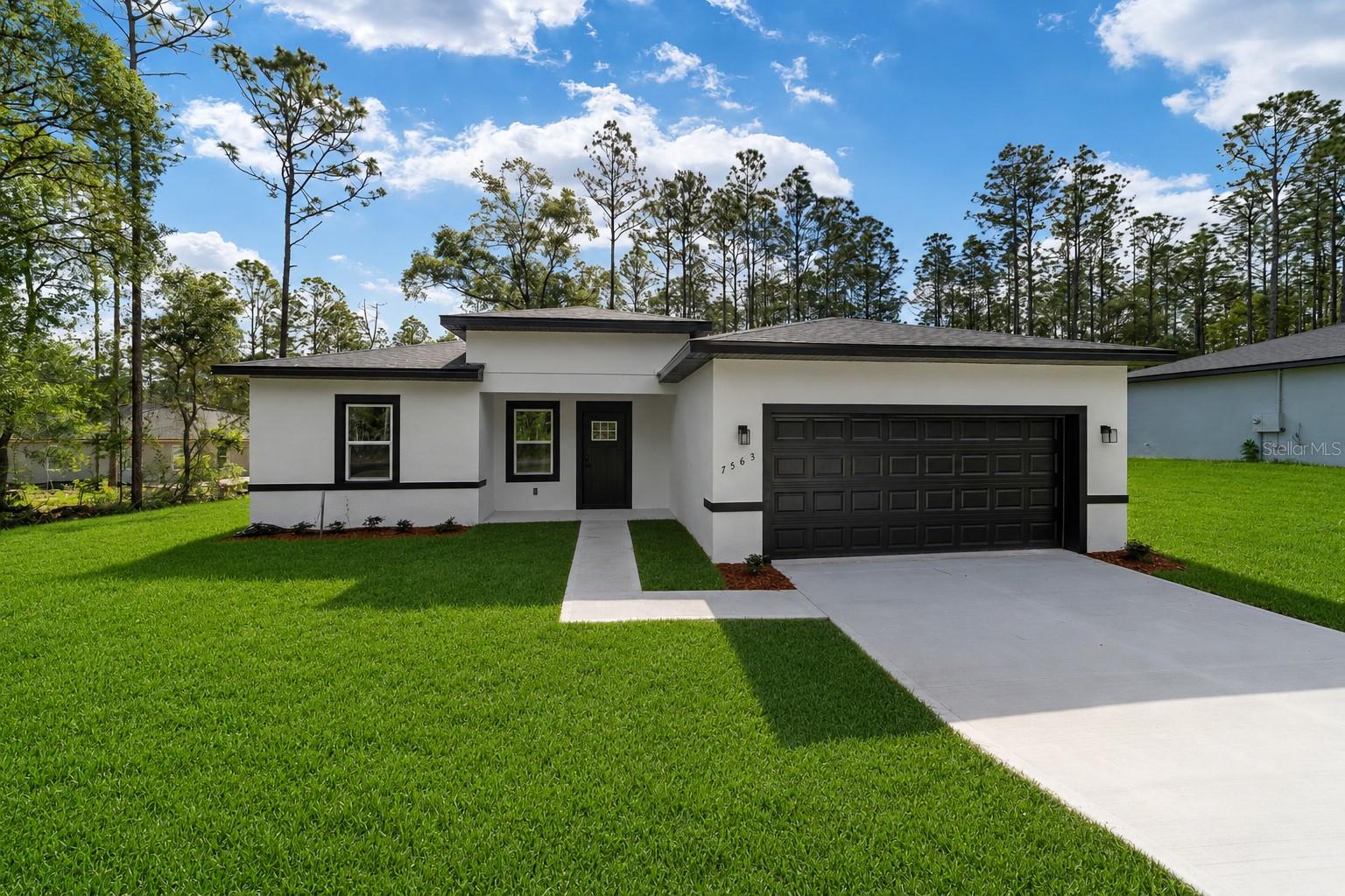 Discover modern elegance in this brand-new construction, featuring 4 spacious bedrooms and 2 full bathrooms. From the moment you step inside, you're greeted by tall ceilings and an open, light-filled layout that enhances the home's contemporary charm. At he the heart of the home is a chef's kitchen, complete with quartz countertops, stainless steel appliances and upgraded cabinetry-perfect for cooking and entertaining. The luxurious primary suite offers a true retreat, boasting two large walk0in closets and a spa-inspired bathroom with a soaking tub and dual vanities. Additional highlights include a 2 car-garage for ample parking and storage. Just a short drive to Crystal River or Inverness. Located near the Withlacoochee bike trail! This home perfectly blends comfort, style, and convenience. Don't miss your chance to own this exceptional property.