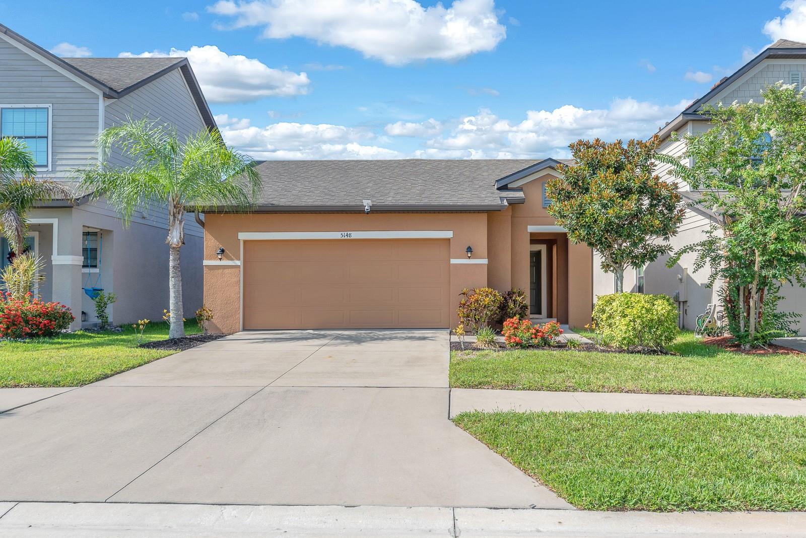 Peaceful pond views set the tone for this single-story home in Sereno, a gated master-planned community in Wimauma. Designed for low-maintenance living, the home offers 2 bedrooms, 2 baths, and a flexible den behind French doors, giving you space for an office, hobby room, reading nook, or guest overflow.

The main living area is open and bright, with the kitchen, dining, and living spaces flowing together for everyday ease. Espresso cabinetry, granite countertops, GE appliances, and recessed lighting give the kitchen a polished, functional feel, while tile flooring through the main living areas keeps things simple. The living room opens to the screened lanai, creating a natural extension of the home and a peaceful place to enjoy the pond views.

The primary suite offers its own calm escape with a tray ceiling, walk-in closet, and en-suite bath featuring a double vanity and spacious walk-in shower. A secondary bedroom and full bath provide comfortable separation for guests or household members. 

Additional value items include an oversized 2-car garage, ample storage space, smart home features, ceiling fans, and hurricane shutters.

Located in the gated Sereno master-planned community in Wimauma, residents enjoy access to resort-style amenities including a clubhouse, community pool, playground, dog park, sports courts, trails, and recreational spaces. With peaceful neighborhood surroundings, pond views, and easy access to the greater Tampa Bay and Sarasota areas, this home offers comfort, convenience, and a lifestyle that feels connected without feeling busy.