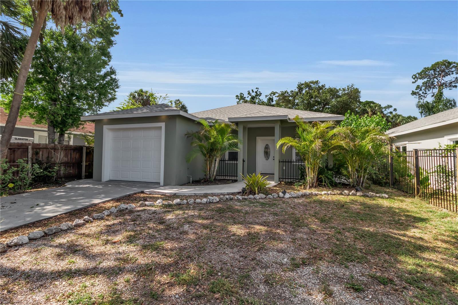 Welcome to this 2022 constructed 3-bedroom, 2-bathroom home situated on a 7,500 sq ft fenced lot with a gated driveway shaded by beautiful mature oak trees. The home features a bright, open layout with a spacious great room, ideal for everyday living and entertaining.

Interior highlights include 9-foot ceilings and travertine tile flooring throughout, creating a clean and cohesive feel. The primary bedroom offers a comfortable retreat with a large walk-in closet, while the additional bedrooms provide flexibility for guests, family, or a home office.

The outdoor space offers plenty of room to enjoy, with a fully fenced yard and natural shade, perfect for relaxing or future customization.

Conveniently located just north of Downtown Sarasota, this property offers a great opportunity for both homeowners and investors seeking a move-in ready home with lasting value. Enjoy quick access to some of the area’s best restaurants, shopping, and entertainment, along with nearby boat ramps and water access for an easy connection to Sarasota’s boating lifestyle. Local parks are also just minutes away, perfect for outdoor activities and relaxation.

With newer construction, a generous lot, and a prime location close to everything Sarasota has to offer, this property is well-suited for a variety of buyers.