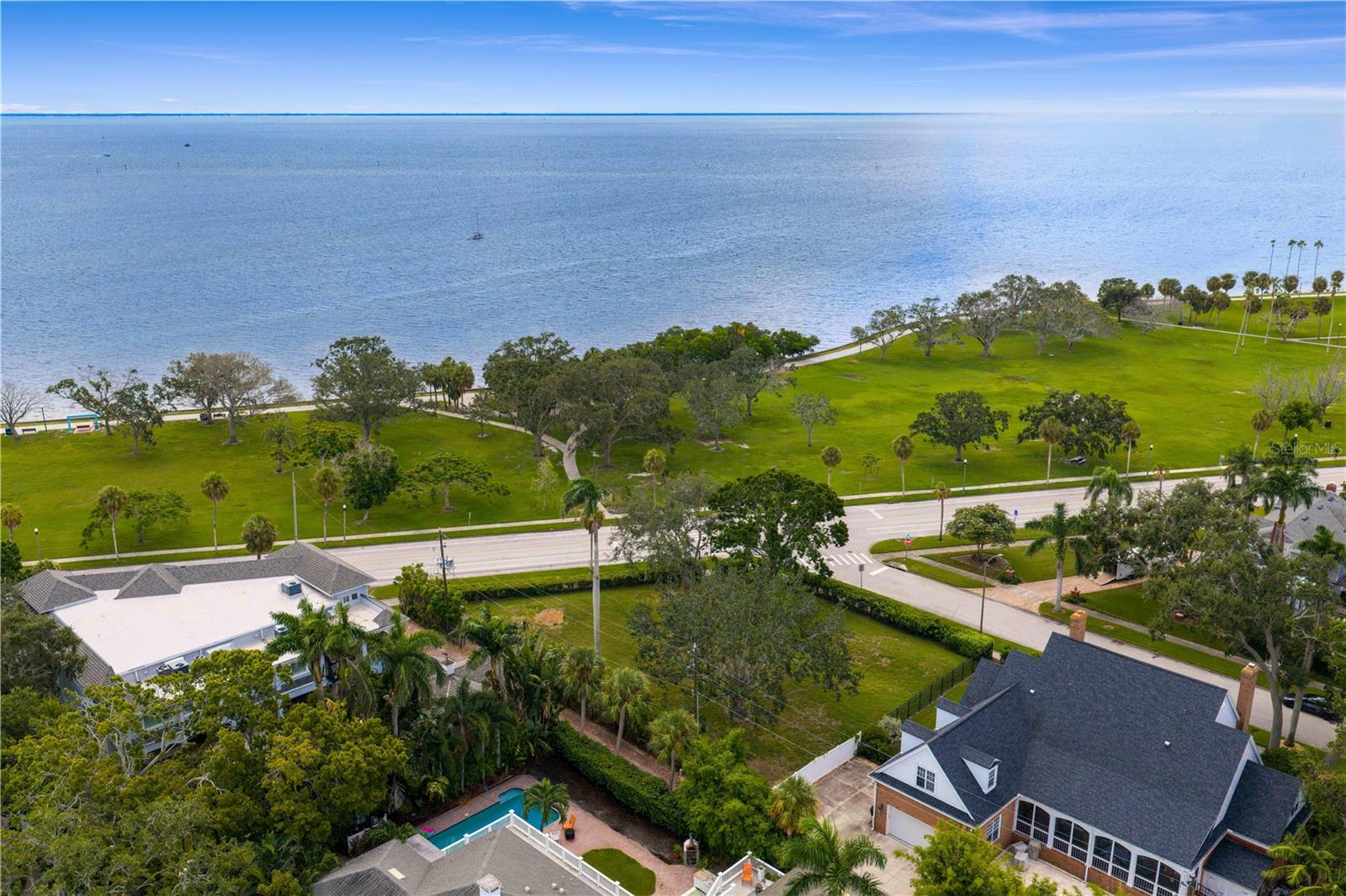 Monaco has Avenue Princesse Grace, Los Angeles has the Pacific Coast Highway and in St. Petersburg, the most coveted waterfront address is North Shore Drive NE.  Stretching just 0.8 miles along the shimmering edge of Tampa Bay, this iconic thoroughfare connects Coffee Pot Bayou to the Vinoy Park and Resort and vibrant downtown St. Pete.  Lined with some of the city’s most prestigious estates, North Shore Drive NE offers a rare blend of elegance, walkability, and breathtaking view along North Shore Park spanning 33 acres with beach, playgrounds, parks, tennis courts and then connects to the Vinoy Park another 11.6 acres of waterfront with more sweeping views of Tampa Bay popular for gatherings, festivals and relaxing by the water.  And connecting on the other side toward Coffee Pot Bayou, another inlet off Tampa Bay with frequent wildlife sightings including manatees, dolphins, herons, egrets, gulls and turtles.  Now, for the first time in years, an exceptional opportunity awaits: the chance to build your custom home on one of the most admired streets in all of St. Petersburg.