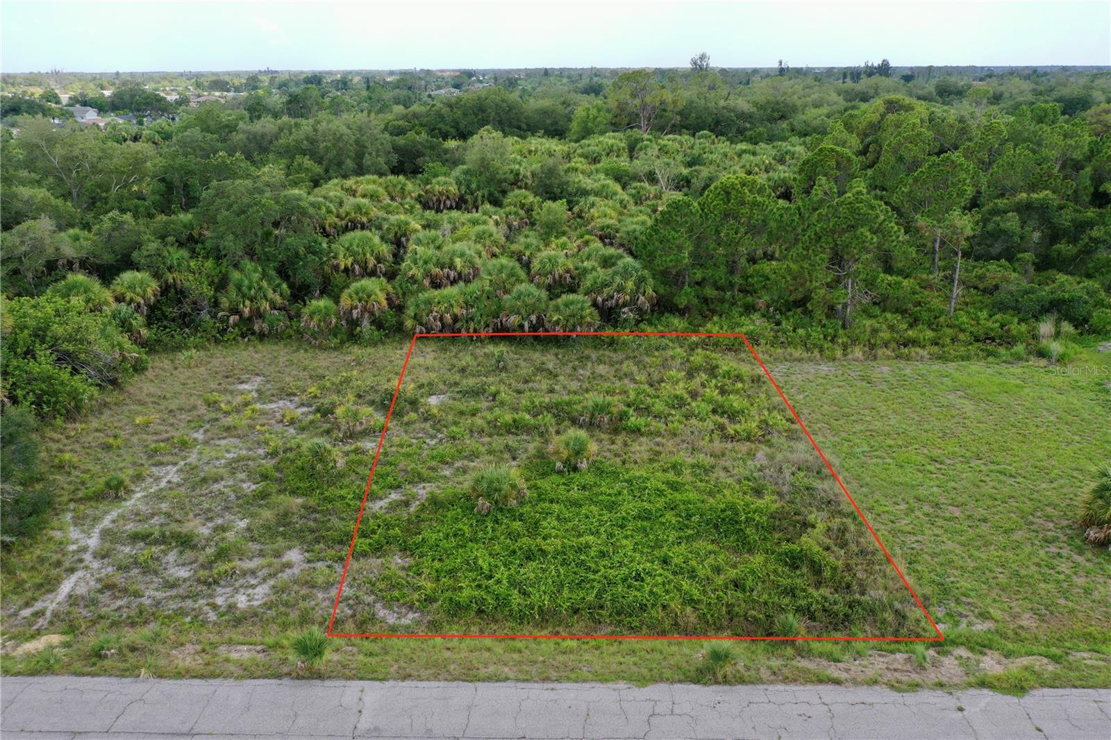 Tucked away in the peaceful a secluded and highly sought-after area of Warm Mineral Springs neighborhood, this premium residential lot offers a truly unique opportunity to build your custom Florida retreat. The 75'x111 (8,250 sqft) property features exceptional privacy, backing directly up to the sprawling, protected Warm Mineral Springs Park acreage, ensuring a serene, natural backdrop with no rear neighbors. Situated entirely within a preferred X flood zone, this parcel allows you to design and construct your dream home with total confidence while completely avoiding mandatory flood insurance. With zero HOA fees or restrictive deed guidelines, you enjoy the absolute freedom to layout your property as you see fit—whether that means adding a pristine backyard pool, building a detached workshop, or parking your boat and RV right at home. The property is NOT in a Scrub Jay zone and there are no wetlands showing on the property according to the National Wetlands Inventory.

The parcel boasts a level, buildable footprint with electricity readily available nearby, streamlining your path to breaking ground. From this prime Southwest Florida location, you are just moments from the therapeutic waters of the springs, local dining, and daily conveniences. You also enjoy quick access to US-41 and Interstate 75 for effortless commuting, while the booming entertainment hub of Wellen Park and the world-class sandy beaches of the Gulf of Mexico are only a short drive away.