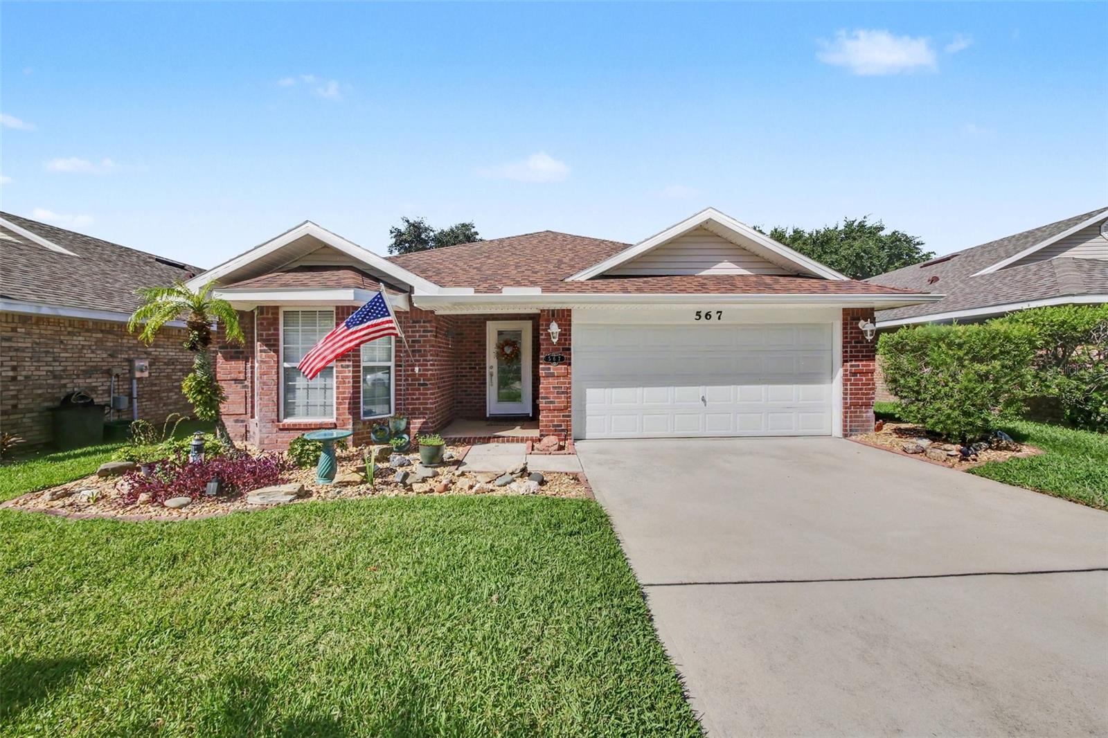 Welcome to this beautifully updated waterfront pool home located in a small gated community of approximately 300 homes. One of the few residences in the neighborhood to feature its own private heated pool, this property also enjoys peaceful lake views from the backyard, creating the perfect setting for relaxing or entertaining. In addition to your private pool, residents have access to a heated community pool, clubhouse, and fitness center. The monthly HOA fee of $186.23 includes lawn maintenance and irrigation, allowing for low-maintenance living. This home has been extensively updated w/ numerous improvements, including a new A/C system w/ all new ductwork (2026), a new weather monitoring system (2026), new carpet in the primary bdrm (2025), a new pool chlorinator cell (2025), and a new roof & gutters (2024). The beautifully remodeled kitchen (2022) features quartz countertops, updated cabinetry, custom glass display cabinets in the adjacent sitting area, color-changing under-cabinet lighting, a new induction range, & a new refrigerator. Additional improvements include a new pool heater (2022) and the addition of a covered, screened lanai, providing an inviting outdoor living space overlooking the lake & pool. Conveniently located with easy access to I-95 and US-1, this home is just minutes from shopping, dining, medical facilities, parks, and public boat ramps. New Smyrna Beach is approximately 20 minutes away, offering the perfect balance of everyday convenience & FL coastal living. Heavy duty new portable generator conveys with the property. 50 amp electric car charger in garage. If you've been searching for a move-in-ready waterfront home w/ a private heated pool, exceptional updates, & outstanding community amenities, this property is one you won't want to miss. Recent appraisal completed, value: $404,000.