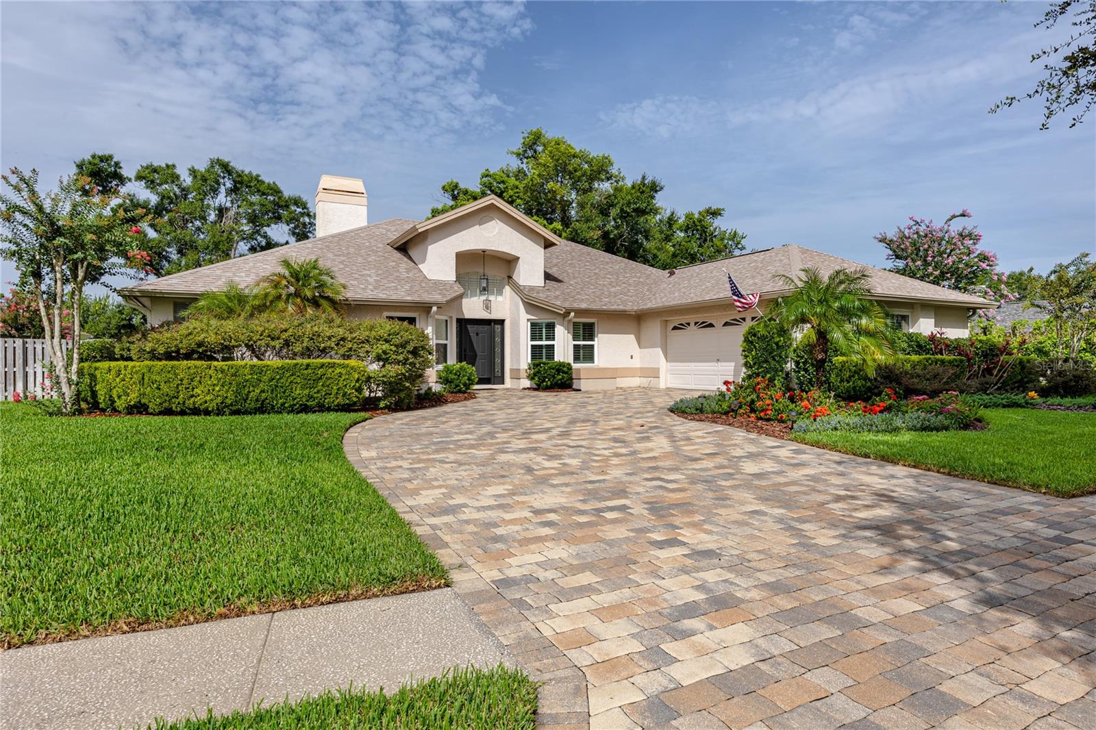 Virtually Staged. Welcome home to 16706 Windsor Park Drive, a gorgeous 4-bedroom, 2-bathroom family retreat set on a quiet, tree-lined street in a sought-after community. Mature landscaping frames this thoughtfully designed split-plan home, offering privacy for family and guests alike, PLUS a versatile bonus room ideal for a HOME OFFICE or study and a formal dining room for entertaining. The heart of the home is a beautiful kitchen featuring granite countertops and stainless steel appliances, opening seamlessly to a spacious family room anchored by a cozy wood-burning fireplace. The oversized primary suite is a true retreat, boasting TWO WALK IN CLOSETS and an EN-SUITE bath with an oversized walk-in shower and tasteful, SPA-INSPIRED finishes.   Step outside to an oversized, PAVERED SCREENED LANAI overlooking a peaceful CONSERVATION lot - the perfect setting to enjoy Florida's year-round weather or host gatherings in complete privacy. The FULLY FENCED backyard backs to conservation and is ideal for pets and outdoor play.  This home offers an abundance of STORAGE throughout, including generously sized bedroom closets, multiple hall closets, laundry room cabinetry, and garage shelving in the 2-car garage. Newer carpet (2024) graces the bedrooms while tile flows throughout the main living areas for a fresh, move-in-ready feel. Additional highlights include a NEWER ROOF (2024), PLANTATION SHUTTERS on every window, large PAVER driveway, newer washer and dryer (2024), water softener (2025), new windows (2024), ductwork (2024),  vaulted ceilings and multiple sliders offering tons of natural light.  Residents enjoy outstanding community amenities including 24-hour security, multiple parks and picnic areas, hiking trails, a playground and a dedicated dog park. The location is unbeatable - close to shopping and dining, with quick access to I-275 and just a short drive to Tampa International Airport and downtown Tampa.  Don't miss this rare opportunity to own a stunning home with a private conservation-view in an amenity-rich community. Schedule your showing today.