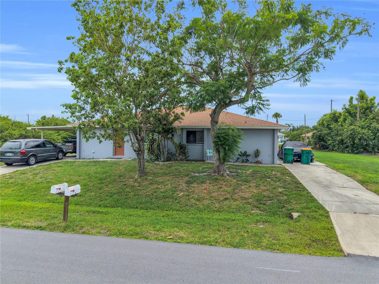 Excellent investment opportunity in Englewood! One side has been COMPLETELY REMODELED!! This DUPLEX sits on a spacious corner lot and offers approximately 1,918 total square feet of living space. Each unit features 2 bedrooms, 1.5 baths, huge walk-in closets, a private entrance, open living and dining areas, spacious kitchens with ample cabinetry, and screened rear lanais. One unit has been recently updated with quartz countertops, luxury tile flooring, a remodeled shower, new kitchen appliances, and a tankless water heater, while the other unit is occupied by a long-term tenant. Separate driveways, individual utility meters, and a convenient location near shopping, dining, golf courses, parks, and Gulf Beaches make this property ideal for investors, seasonal residents, or those seeking rental income potential!!!