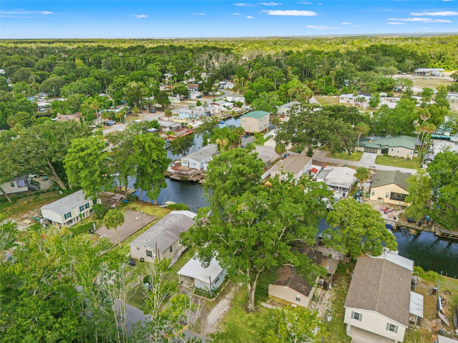 Wake up to breathtaking canal views with only a short boat ride to the Gulf. Imagine sipping your morning coffee on a freshly stained deck, watching the water catch the early light, knowing that today you could be on the Gulf by noon. This beautifully updated 4 bedroom, 2 bathroom waterfront retreat truly checks every box. Whether you are searching for your forever home, a vacation escape, or a short term rental that practically books itself, the options here are endless. From the moment you pull into the driveway, you will notice the care and attention that has gone into this property. A newer roof (November 2023), flooring (2024), and hot water heater (2024) mean the big ticket items are already taken care of so you can focus on living. Inside, newer stainless steel appliances make the kitchen a joy to cook in, and with waterfront views right out the window, even doing the dishes feels like a vacation. Step outside and the real magic begins. The newly stained and refreshed deck is made for long evenings, good food, and even better company. The dock, just four years old, is ready and waiting for your boat, kayak, or paddleboard. With direct canal access leading straight to the Gulf, weekend adventures are never more than a short ride away. This is the kind of waterfront access some spend years searching for. Tucked near the beloved Rogers Park and surrounded by some of the best that Weeki Wachee has to offer, this location is as convenient as it is charming. Nature preserves, local restaurants, and the famous Weeki Wachee Springs are all just minutes away, making this an incredibly attractive destination for visitors and a genuinely wonderful place to call home. Perhaps best of all, this home has no history of flooding. That kind of peace of mind on a waterfront property is rare and truly priceless. Whether you are casting a line off the dock at sunrise, hosting friends for a Gulf Coast sunset, or welcoming guests for a short term rental stay, this home delivers the waterfront lifestyle in every sense of the word. This home checks so many boxes, come see it for yourself before someone else does!