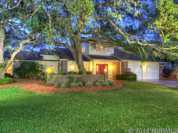Gorgeous hangar residence located in Spruce Creek Fly In Community, America's premier airpark; 4000' paved runway w/GPS approach & VASI lights; minutes to restaurants, shopping & theater, 15 min from World's Most famous beach, 20 min to Embry Riddle Aeronautical Univ., 1 hr to Orlando & 3 hrs to Miami. This private, gated community offers championship golf, pool, tennis, spa, hair salon, restaurant, private airport, kids rec ctr & park, 24/7 roving security. Remodeled inside & out! Stunning travertine tile in foyer, kitchen & owner's bath. Fabulous eat-in kitchen w/ custom cabinets, granite counters, center island, pantry, stainless appliances & double ovens. Huge great room w/ stone fireplace & volume ceilings. Formal dining area. First floor owner's suite features two walk-in closets plus a lavish travertine bath w/ dual vanities, granite counters, jetted tub & large walk-in shower. 2nd floor includes two guest BR's, Jack n Jill bath & loft area perfect for office. Rear screened porch opens to pavered patio w/ fire pit & wrought iron fenced yard w/ room for a pool. Large laundry w/ plenty of work space. 43 x 37 hangar w/ air conditioned pilot's lounge, work shop & full bath; door opening is 40' x 10'9". Large apron w/ plenty of ramp space for guest tie down. Roof new in 2004, newer hurricane rated windows, 2 HVAC systems new 2011, newer stucco exterior, termite bond. Located on taxiway Kilo. Excellent location on dead end street. ;Water: City