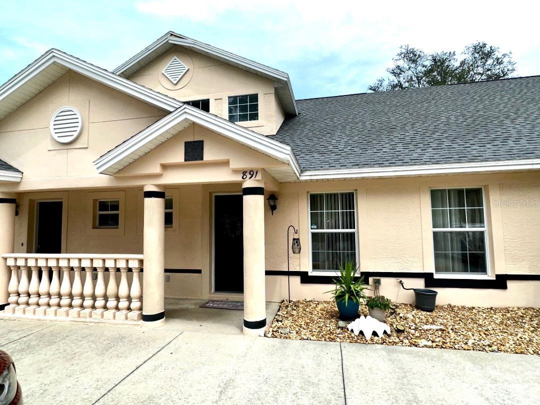 This move-in ready 3 bedroom, 2 bath townhome in Lakeside of Inverness is the perfect blend of modern updates and low-maintenance living. The kitchen has been tastefully remodeled with granite countertops and stainless steel appliances, while luxury vinyl flooring enhances the main living area and plush carpet adds comfort in all three bedrooms. Two private balconies extend your living space, offering quiet spots to relax or entertain. A thoughtfully placed laundry area makes everyday living convenient, and low monthly HOA fees covering cable and trash keep ownership affordable. With some furniture and furnishings included, you can settle in right away and start enjoying the easy lifestyle this home offers—all just minutes from the best area amenities.