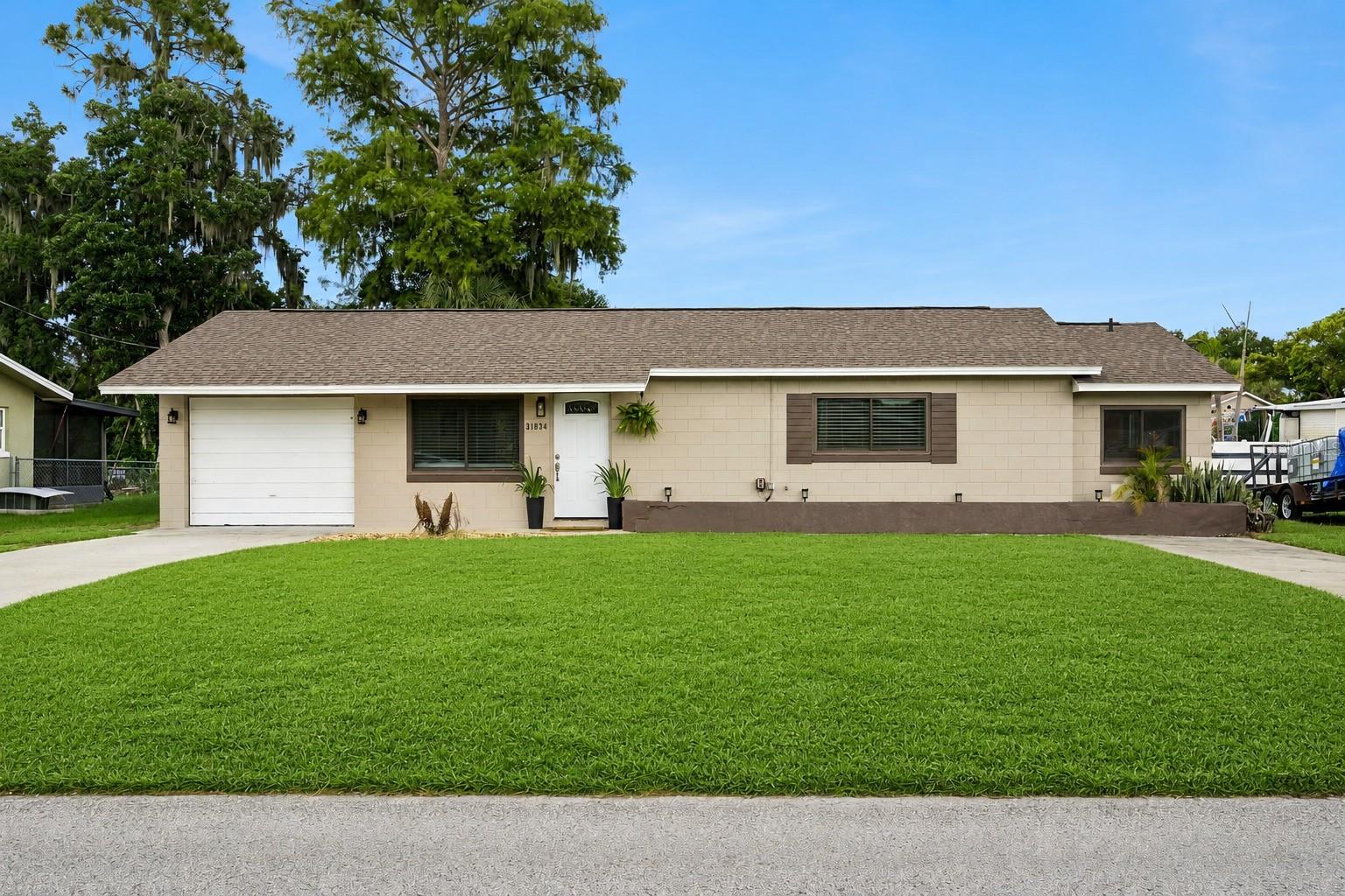 Virtually Staged. Move-In Ready and Packed with Upgrades! Welcome to this beautifully renovated 2-bedroom, 2-bath home featuring a versatile bonus room that can easily serve as a home office, fitness room, or hobby area. Designed for comfortable everyday living, this home offers modern finishes, major system updates, and a location that puts you close to everything Central Florida has for you.

Step inside to discover an inviting open layout with durable tile flooring throughout—absolutely no carpet—providing a clean, elegant look that's both stylish and easy to maintain. The updated kitchen showcases modern cabinetry installed in 2022, offering generous storage and a contemporary feel that flows seamlessly into the living and dining areas. Both bathrooms were also refreshed with updated cabinetry in 2022, creating a cohesive, move-in-ready interior.

Enjoy added confidence knowing many of the home's most important improvements have already been completed, including:

New roof (2022)
New A/C air handler (2022)
Energy-efficient windows (2023)
Kitchen and bathroom cabinetry (2022)
Water softener
Tile flooring throughout the entire home

Outside, you'll appreciate a property designed for low-maintenance living, giving you more time to enjoy everything the surrounding area has for your family.

Ideally located in the heart of Tavares, America's Seaplane City, you're just minutes from the charming downtowns of Mount Dora and Eustis, where you'll enjoy waterfront dining, boutique shopping, local breweries, farmers markets, festivals, live entertainment, and year-round community events. With Orlando only about an hour away, world-famous attractions, international airports, premier shopping, and endless entertainment are always within easy reach.

Whether you're searching for your first home, looking to downsize, or adding to your investment portfolio, this property offers the perfect combination of modern updates, convenience, and exceptional value.

Don't miss this incredible opportunity to own a beautifully updated, truly move-in-ready home in one of Central Florida's most desirable locations. Schedule your private showing today!