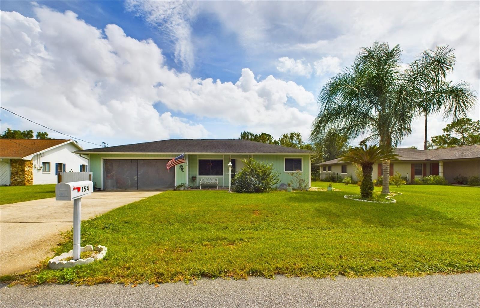 Welcome to this charming 3-bedroom, 2-bathroom gem nestled in the heart of Palm Coast, FL. This 1986 home boasts 1,477 square feet of comfortable living space, perfect for those who appreciate a cozy atmosphere. Step inside and be greeted by the warmth of the inviting living area, where windows allow for natural light to cascade in, creating a bright and cheerful ambiance. The open floor plan seamlessly connects the living room to the dining area, making it an ideal space for gatherings and entertaining. The kitchen offers that Vintage 1980's look for as long as you would like to enjoy. The kitchen pass through opening provides a good vantage point from kitchen to dining room. You'll appreciate the convenience of preparing meals while staying engaged guests. Venture into the spacious primary bedroom with attached en suite and access to the pool. Two additional bedrooms provide flexibility, and the newly remodeled guest bathroom is designed for both functionality and style. Step outside into your very own oasis, complete with a pool that beckons on warm summer days. The covered lanai allows for plenty of shade while lounging and enjoying the outdoors. Generously sized backyard offers plenty of room for outdoor activities, gardening, or simply lounging by the pool. Located in a tranquil neighborhood, this home offers the perfect blend of suburban comfort and city convenience. With schools, parks, and shopping centers nearby, it's a fantastic place to call home. Don't miss your chance to own this delightful 1986 3-bedroom, 2-bathroom home with a pool. Schedule a showing today and experience the timeless appeal of this wonderful property for yourself!