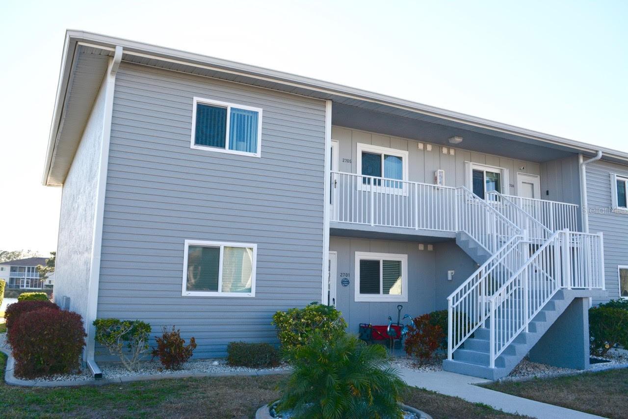 Turnkey Lakefront Living in Egret Point – Lake Suzy, Florida. Welcome to 12274 SW Egret Circle #2705, a beautifully maintained second-floor, End Unit condominium offering serene lake views and effortless Florida living. This move-in-ready 2-bedroom, 2-bath corner unit is being offered turnkey, making it ideal for seasonal residents, snowbirds, or anyone looking to simplify and downsize without compromising comfort. The thoughtfully designed kitchen features a pantry and a full suite of appliances, including a Frigidaire dishwasher, microwave (2026), stove, and refrigerator, LG washer and dryer (2024), adding modern convenience that can be controlled remotely from your smartphone. The main living areas are finished with tile flooring, while both bedrooms provide plush carpeting and ceiling fans for comfort. The spacious primary suite includes a walk-in closet, and the screened lanai provides the perfect setting to relax with your morning coffee or evening beverage while overlooking the peaceful waters of Lake Suzy. Your private parking space is conveniently located just outside the unit, and the HOA provides exterior maintenance for easy, low-maintenance living. The roof is concrete providing peace of mind for inclement weather. Residents of Egret Point enjoy access to a community pool, clubhouse, and bocce courts in a pet-friendly setting (small pets welcome). Located just minutes from Alligator Creek’s Alleron Golf Club, this property is also a short drive to Charlotte Harbor and historic downtown Punta Gorda, where you’ll find waterfront dining, boutique shopping, marinas, and year-round events. Everyday conveniences are close by, including Publix, Walmart, and gyms all within 10 minutes.  Medical facilities, restaurants, and the soon-to-open Buc-ee’s is approximately 15 minutes away — adding even more value and accessibility to this desirable location. Easy access to I75 under 10 minutes and approximately 30 minutes to the beaches.  Whether you’re seeking a seasonal retreat or a full-time Florida lifestyle, this lakeview condo offers comfort, convenience, and community. Schedule your private showing today. PERSONAL ITEMS AND COMPUTER ARE EXCLUDED. INFORMATION IS DEEMED RELIABLE BUT NOT GUARANTEED AND SHOULD BE INDEPENDENTLY VERIFIED BY THE BUYER AND/OR BUYER'S AGENT.