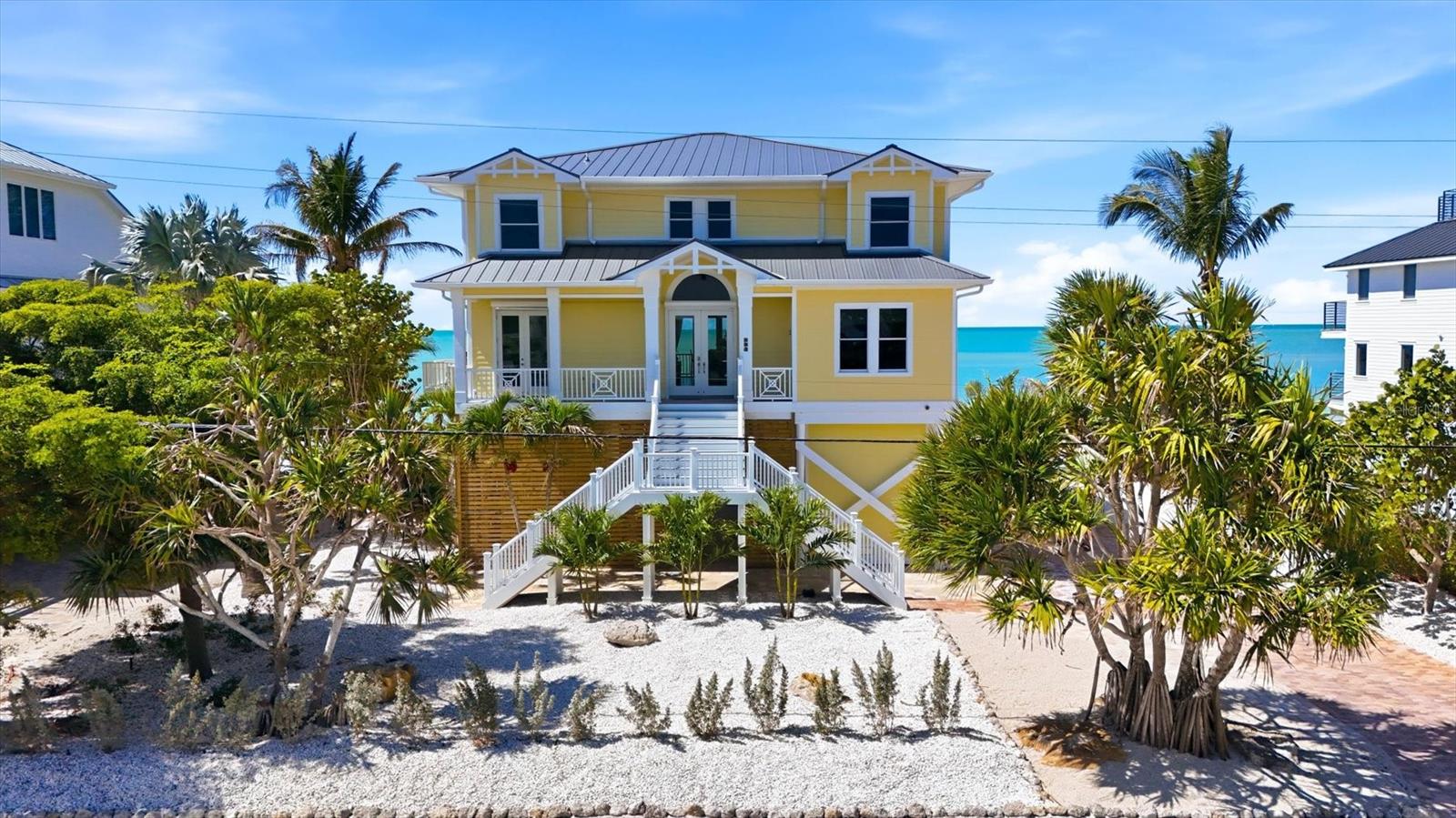DIRECT BEACHFRONT LUXURY ON DON PEDRO ISLAND | OLD FLORIDA AT ITS FINEST

Escape to the unspoiled beauty of Don Pedro Island, where quiet shell-lined beaches, breathtaking sunsets, and sunshine-filled days define true coastal living. This exceptional 4-bedroom, all en-suite, 5-bath residence offers the perfect blend of luxury, comfort, and island charm in one of Florida’s most treasured hidden gems.

Designed to capture the essence of the coast, the home features an open, airy floor plan with a stunning wall of sliding glass doors that seamlessly connect indoor and outdoor living, leading to a spacious beachfront lanai where Gulf breezes and panoramic views take center stage.

The main living level is thoughtfully appointed for both everyday living and entertaining, showcasing a chef’s kitchen complete with a 6-burner gas cooktop, double ovens, warming drawer, wet bar, and an expansive island ideal for gathering. The inviting living room is enhanced by custom built-ins and a gas fireplace, creating a warm yet sophisticated coastal ambiance. A private office/den (optional 5th bedroom) and full bath complete the first floor.

Access all levels with ease via the 3-stop elevator, leading to the second floor where 3 of the 4 bedrooms open to a private upper lanai, offering sweeping Gulf views and tranquil retreats for guests and family alike.

On the ground level, you’ll find generous covered space and storage, perfect for entertaining, relaxing, or creating your own island-style outdoor living area.

Built for peace of mind, this home meets current hurricane codes and elevations and includes a generator backup, newer roof, and new irrigation system to maintain lush tropical landscaping.

Located on Palm & Don Pedro Islands, where there are no high-rises, no traffic, & no stress,  accessible via a 3+/- car ferry ride, this is one of the last places in the country where you can truly experience Old Florida living—just golf carts, sandy paths, and endless shoreline to explore.