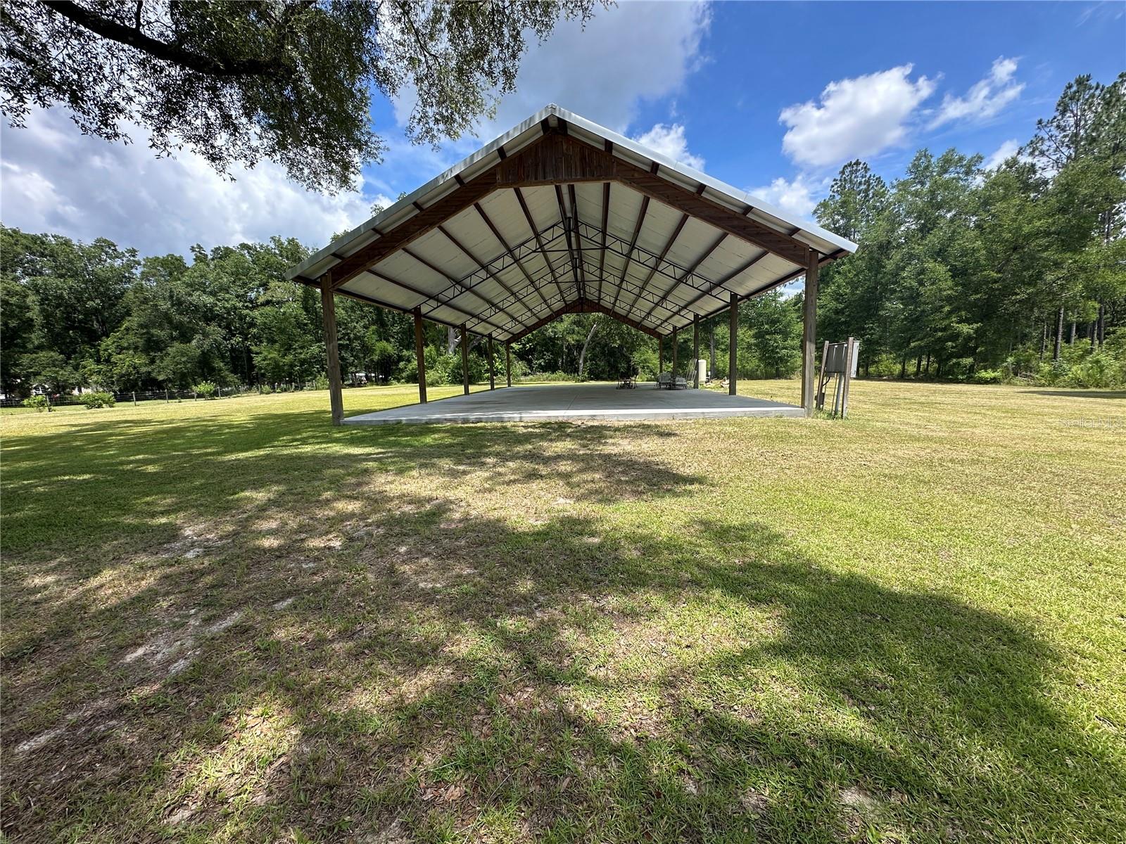 Under contract-accepting backup offers. Discover the perfect blend of opportunity, convenience, and country charm with this exceptional 5-acre parcel located directly off US Highway 441. High and dry and currently zoned Agricultural, this versatile property offers endless possibilities for a nursery, a hobby farm, a private estate, or a future investment opportunity. The property is already equipped with valuable improvements, including a private well, two 200-AMP electrical panels, partial fencing, and an impressive, fully permitted 40x80 pole barn situated on a concrete slab. Whether you're looking for equipment storage, RV parking, a workshop, event space, or the foundation for your future homesite, this property is ready to accommodate your vision. Beautiful mature oak trees, open green space, and a mix of cleared and wooded areas create a picturesque setting while providing both privacy and usability. The expansive acreage offers ample room for a custom home, agricultural pursuits, recreational activities, or additional structures. Strategically located with excellent visibility and accessibility from US Highway 441, this property may also present future commercial or residential development potential, subject to county approvals and rezoning requirements. With existing infrastructure and a prime location, this is a rare opportunity to own a property that combines immediate functionality with long-term potential. Whether you're seeking a private retreat, business venture, or investment property, the possibilities are truly endless.