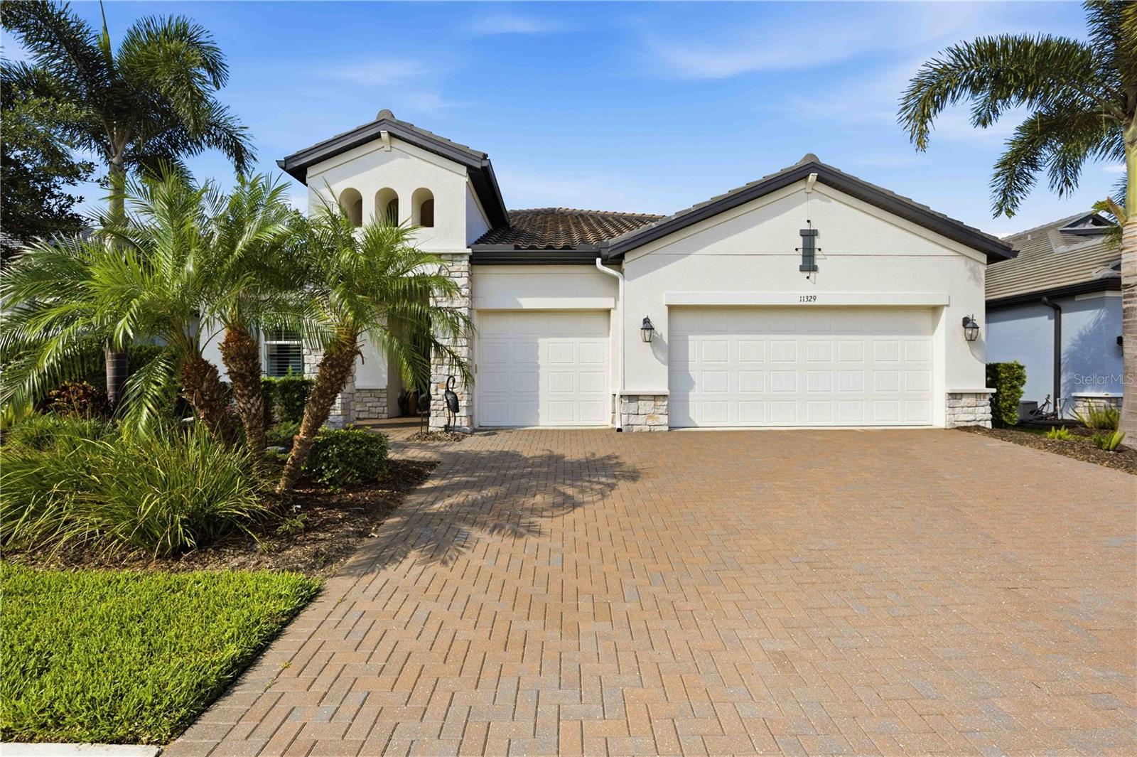 Rarely available Genie model located in the highly sought after, maintenance free community of Oasis in Wellen Park. This stunning home boasts 3 spacious bedrooms PLUS an Office/DEN/4th bedroom, 3 full bathrooms, 3 car garage, PLUS a heated SALTWATER Pool with spa making it the epitome of MOVE IN READY combining modern elegance with everyday functionality. The gorgeous gourmet kitchen includes TONS of upgraded 42" white shaker cabinetry with under cabinet lighting, stainless steel appliances, a built-in oven, cooktop, NEW stylish stone backsplash & a walk-in pantry! An expansive kitchen island with quartz counters overlooks the huge living room with tray ceilings and a gorgeous CUSTOM fireplace wall with under shelf lighting, stone center, and added cabinetry for extra storage. The spacious Master Bedroom & En-Suite Bath is located just off the living room with pool views, a tray ceiling, oversized walk-in closet, an upgraded frameless glass shower with Jack & Jill vanities, and quartz counters. At the front of the home, you will find a private den/office/extra bedroom, a second master suite with a large walk-in closet and an en-suite bathroom, a private laundry room with added cabinetry, and an additional guest bedroom and full guest bathroom. Sliding glass doors throughout lead to your extended covered lanai area overlooking a preserve and offering plenty of room for outdoor entertaining! The custom-built pool includes a large sun shelf, PebbleTec finish, color changing LED lights, SPA with therapy jets, and a pool/spa heater! Additional upgrades include whole house rain gutters with leaf guard, 8-ft. doors throughout, no carpets, upgraded exterior elevation with stone accents, updated landscape with tropical palm trees, exterior landscape lighting, pool cage lighting, plantation shutters throughout, IMPACT WINDOWS, NEW electric roll down storm screen for the lanai, many smart home features, epoxy garage floors, and plenty of added storage throughout. Oasis offers a variety of activities including pickleball courts, a community pool, a clubhouse, sidewalks throughout, and a dog park. Located close to downtown Wellen Park, amazing Gulf Beaches, shopping, golf and dining nearby.