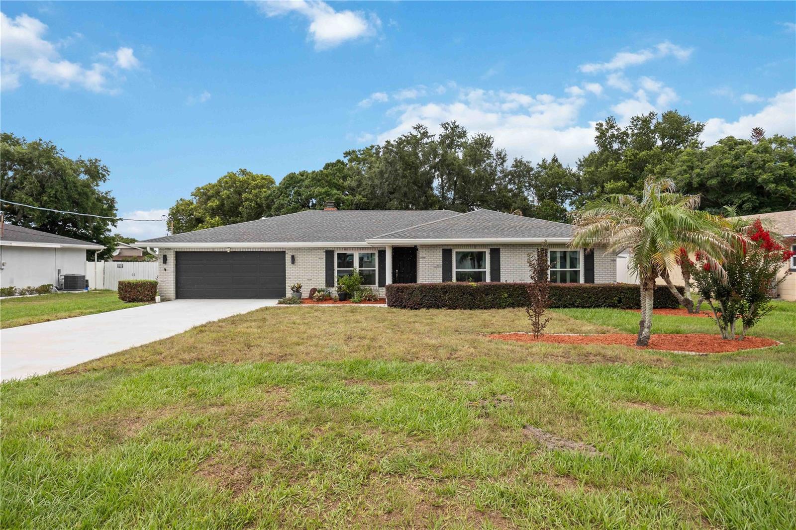 Welcome to this beautifully updated 4-bedroom, 2-bathroom pool home in desirable Southeast Winter Haven. This move-in ready residence sits on a spacious lot with fantastic curb appeal and an incredible backyard oasis.  Extensively updated in 2019 and meticulously maintained, the home features an open, light-filled layout with fresh white walls, stylish luxury vinyl flooring, and a cozy brick fireplace. The kitchen offers white cabinetry, stainless steel appliances, quartz countertops, and a dining area perfect for entertaining. The property includes four generous bedrooms—including a primary suite with a walk-in closet—versatile spaces for work or play, and a charming entry gallery. Additionally, a new roof was installed in January 2021.  The backyard was further enhanced in 2025 with a complete pool renovation, a new paver deck, and a screened patio. This large covered area with ceiling fans overlooks the refinished pool, while the fully privacy-fenced yard provides ample room for recreation.  Conveniently located near local amenities, schools, LEGOLAND, and the Chain of Lakes, this home perfectly combines comfortable living with the Florida lifestyle.

Call today to schedule your private tour, this is a gem you won't want to miss!