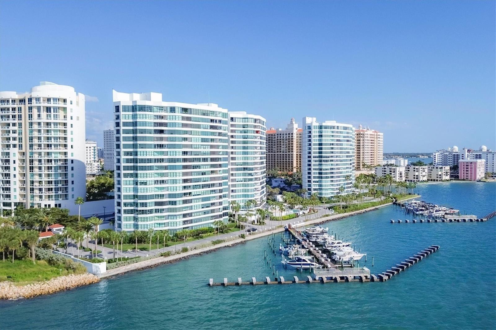 With Sarasota’s endless sunshine and breathtaking coastal vistas, the views from this residence truly go on forever. From the 18th floor, enjoy full, unobstructed panoramas of Sarasota Bay stretching all the way to the Gulf of Mexico on the horizon—views attainable only from the 18th and 19th floors, where residences are rarely available.

This exceptional home has been completely remodeled to a refined, contemporary living space. The main living areas and kitchen feature select UA Grecian Series Natural Hickory wood flooring, adding warmth and sophistication throughout.

The renovated kitchen and two bathrooms showcase soft-close European-hinge cabinetry and granite countertops. The kitchen is equipped with high-end KitchenAid appliances, including a refrigerator, convection oven, microwave, cooktop, vent hood, and dishwasher. A full-size stacked GE washer and dryer are conveniently and discreetly integrated into the kitchen design.

Thoughtful upgrades enhance both comfort and wellness, including a REME HALO whole-home air purification system, Everpure commercial-grade water filter in the kitchen, and a Smith Proline commercial-grade water heater. Recently replaced Plaza HBP Low-E sliding glass doors (Miami-Dade rated) frame the spectacular views, while Llumar Vista security window film—with a lifetime guarantee—adds peace of mind in the primary bedroom.

Additional custom touches include a floating bar in the living room and elegant Allure window shades, with motorized shades in the primary bedroom.

The Condo on the Bay community offers a wide array of amenities exclusively for its residents and guests of both Towers I and II. These amenities include: • 2 Swimming Pools - North and South, • 4 Lighted Pickleball Courts, • Lighted Tennis Courts, • Exercise Facilities & Sauna Rooms, • Boat Docks, Kayak Racks, and Fishing Piers - North and South. This active community also participate in many social events such as Mahjongg & card games, discussion & screening, family/group gatherings and fellowship, and Happy Hour. There is something here for everyone! It is time to experience a luxurious urban life from the 18th floor of Tower II, in the pulsing heart of Downtown Sarasota!