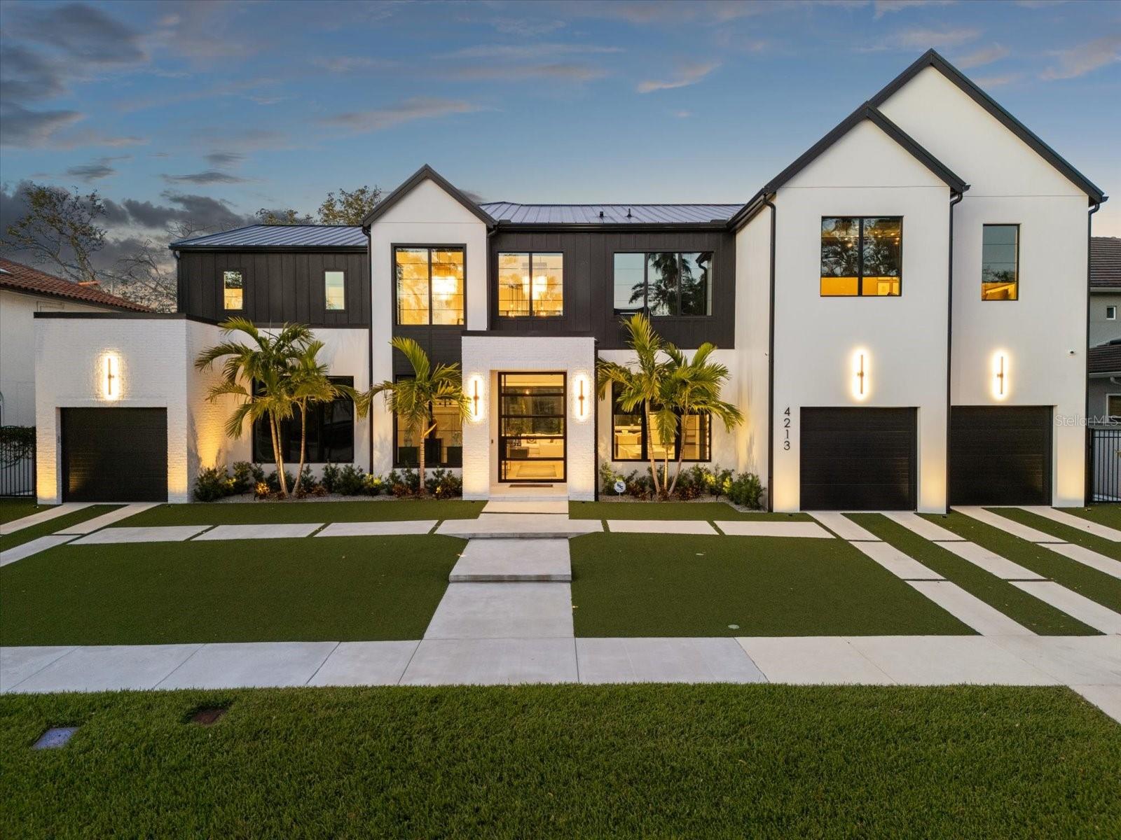 ***Accepting backup offers. Welcome to the pinnacle of luxury living! This ultra-luxury modern seven-bedroom, six and a half bath estate is located in the highly sought after neighborhood of Beach Park in South Tampa. This architectural masterpiece offers a one-of-a-kind exclusive residence to those who appreciate the finer things in life.
The custom designed masterpiece, created and fitted by Halo Homes and Modulo Design provides a unique experience as soon as you step in through the 10’ glass and steel custom front pivot door setting the tone for the grandeur within. The estate features an inviting, spacious, open floor plan with a light and airy ambience. Every corner has been curated with bespoke architectural elements, wide plank solid wood flooring, crystal chandeliers, handcrafted wooden fixtures with over one million dollars spent in upgrades. The home features a show kitchen and a chef's kitchen, which includes a sushi bar with brass accents. Both kitchens boast bespoke cabinetry, marble countertops and are fitted with top-of-the-line appliances (Wolf, Sub-Zero), also featuring a state-of-the-art Miele coffee bar.
This residence features multiple oversized living spaces, with floor-to-ceiling windows flooding the interiors with natural light. On the ground floor, the home has both formal and informal living and dining areas featuring a custom champagne wall and a marble liquor display with wine storage. The ground level also includes an en-suite guest bedroom, private gym and custom oversized elevator. The second level has two more en-suite bedrooms, a private cinema and a private luxurious master suite with his and hers separate walk-in wardrobes, marble bathroom and custom steam room. Outside, the property transforms into an entertainer’s paradise complete with a saltwater pool, oversized spa, sun shelf, lighting, speakers, turf landscaping, an outdoor kitchen with PVC cabinetry, oversized grille with a grand covered sun deck, luxe marble pavers and a 6’ block wall for privacy. Modern convenience meets peace of mind with the home’s smart technology, oversized attached outdoor AC storage room and hurricane proof windows. The property also has a higher elevation and remains completely unaffected by any hurricane, providing reassurance to homeowners. Furnishings available on separate contract. 
Situated in South Tampa, this home is just minutes from the area’s best restaurants, vibrant nightlife, shopping and top-rated schools. This estate is second to none, with a host of elegant and details that make it an exceptional home for the most discerning luxury property buyers. Please enjoy video of the home under the virtual tour link.