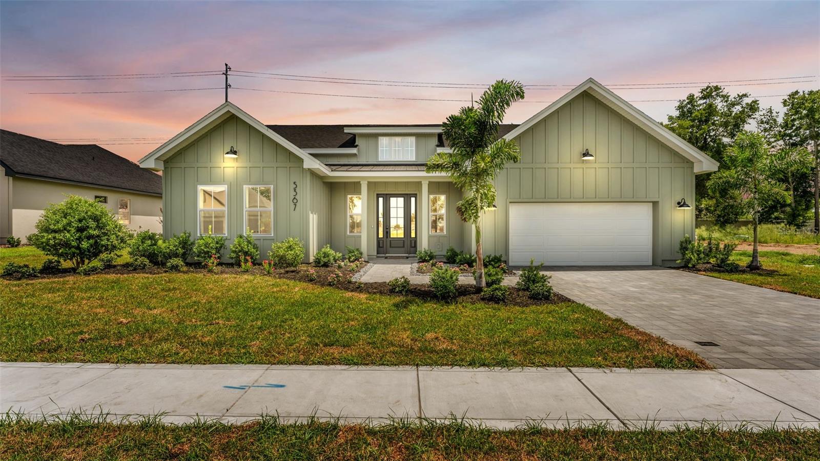 The Baker by Hulbert Homes | Clubhouse Hills Estates — Lakeland, FL
Experience the quality and craftsmanship of Hulbert Homes Inc. with this exceptional new custom home in the gated community of Clubhouse Hills Estates. The Baker floor plan offers 4 bedrooms, 3 bathrooms, and 2,269 heated square feet of thoughtfully designed living space — blending modern style with everyday comfort in one of Lakeland's newest gated communities.
Soaring cathedral ceilings in the great room and owner's suite set the tone for the open-concept design, creating an inviting atmosphere perfect for both entertaining and daily living. Designer finishes are found throughout, including quartz countertops, custom cabinetry, and luxury vinyl plank flooring — all reflecting the superior attention to detail that has become synonymous with Hulbert Homes. Blinds are included throughout, and energy-efficient construction provides lasting comfort and peace of mind from day one.
The well-appointed kitchen features custom cabinetry and quartz counters, opening seamlessly to the main living and dining areas. It extends to a covered lanai complete with a built-in outdoor kitchen and sink — perfect for enjoying Florida's year-round outdoor lifestyle. The pantry and owner's suite closet are outfitted with wood slat shelving, combining beauty with everyday functionality.
Additional upgrades include an acrylic-finished garage floor and elegant paver driveway and walkway, enhancing both curb appeal and long-term durability. The generously sized homesite offers plenty of room to add a future pool, allowing you to create your own private backyard retreat.
Conveniently located near shopping, dining, medical facilities, and major roadways with easy access to downtown Lakeland, this is an outstanding opportunity to own a brand-new custom home built to last. Secure your new home today and enjoy the quality, craftsmanship, and peace of mind that come with every Hulbert Homes build.