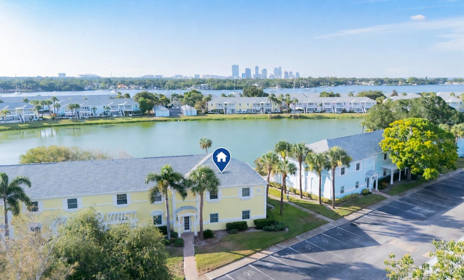 Welcome to paradise at Waterside at Coquina Key, where resort-style waterfront living meets the convenience of downtown St. Petersburg. Nestled within 88 lush, tropical acres, this gated waterfront community offers an unmatched island lifestyle with scenic walking paths, sparkling Tampa Bay views, and world-class amenities just minutes from everything the city has to provide.

This beautifully maintained 2 bed / 2 bath residence has been thoughtfully updated with the major improvements; offering true peace of mind for years to come:

New impact windows (May 2021)
New Samsung stainless steel kitchen appliance package
New A/C system (September 2023)
Completely renovated primary bathroom (October 2023)

The home also features spacious living areas and an oversized patio/deck, creating the perfect setting to relax or entertain while enjoying Florida's year-round sunshine.

Waterside at Coquina Key has undergone extensive exterior renovations and offers an incredible lineup of resort-style amenities, including:

Gated entry
Multiple waterfront swimming pools and spas
Fitness center
Lighted tennis courts
Fishing piers
Three miles of waterfront seawall and walking paths
Pet parks 
Business center
The exclusive Waterside Yacht Club featuring a private, resident-only restaurant
Internet, cable, water, and sewer are all included by the HOA!

Whether you're searching for a full-time residence, seasonal escape, or investor friendly opportunity, this home combines exceptional community amenities with thousands of dollars in recent upgrades, including the home's most expensive components, making it truly move-in ready. Experience the waterfront lifestyle that has made Waterside at Coquina Key one of St. Petersburg's most desirable gated communities, just minutes from downtown, award-winning beaches, shopping, dining, and entertainment.
