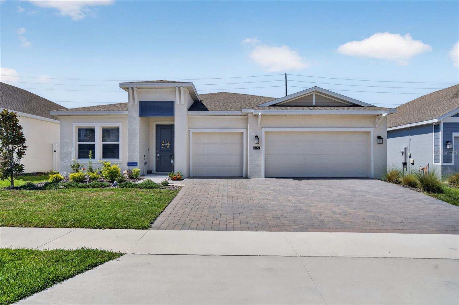 Welcome to this beautifully upgraded 2024 Estero model in the desirable Bronson Ridge community. Offering 2,575 square feet of thoughtfully designed living space, this home combines modern style, everyday comfort, and quality finishes throughout.

The open concept layout is centered around a spacious kitchen featuring quartz countertops, a large island, abundant cabinetry, and a custom designer backsplash that adds a unique touch. The living and dining areas flow seamlessly together, creating the perfect space for entertaining or spending time with family.

Thoughtful upgrades throughout the home include window shutters, upgraded light fixtures, ceiling fans, a whole home water softener, and an epoxy coated 3 car garage floor, giving the home a polished, move in ready feel.

Step outside to the covered lanai, an ideal spot to relax with your morning coffee or unwind at the end of the day. Residents of Bronson Ridge also enjoy a community pool and playground.

Conveniently located near SR 429 and FL 414, you'll enjoy easy access to everyday conveniences and Central Florida's top destinations. Approximate drive times include 5 minutes to Publix and nearby shopping, 15 minutes to Downtown Winter Garden, 20 minutes to AdventHealth Apopka, 30 minutes to Downtown Orlando, 30 minutes to Walt Disney World, 35 minutes to Universal Orlando Resort, and about 35 to 40 minutes to Orlando International Airport.

Beautifully maintained and tastefully upgraded, this home offers the space, features, and convenience today's buyers are looking for.