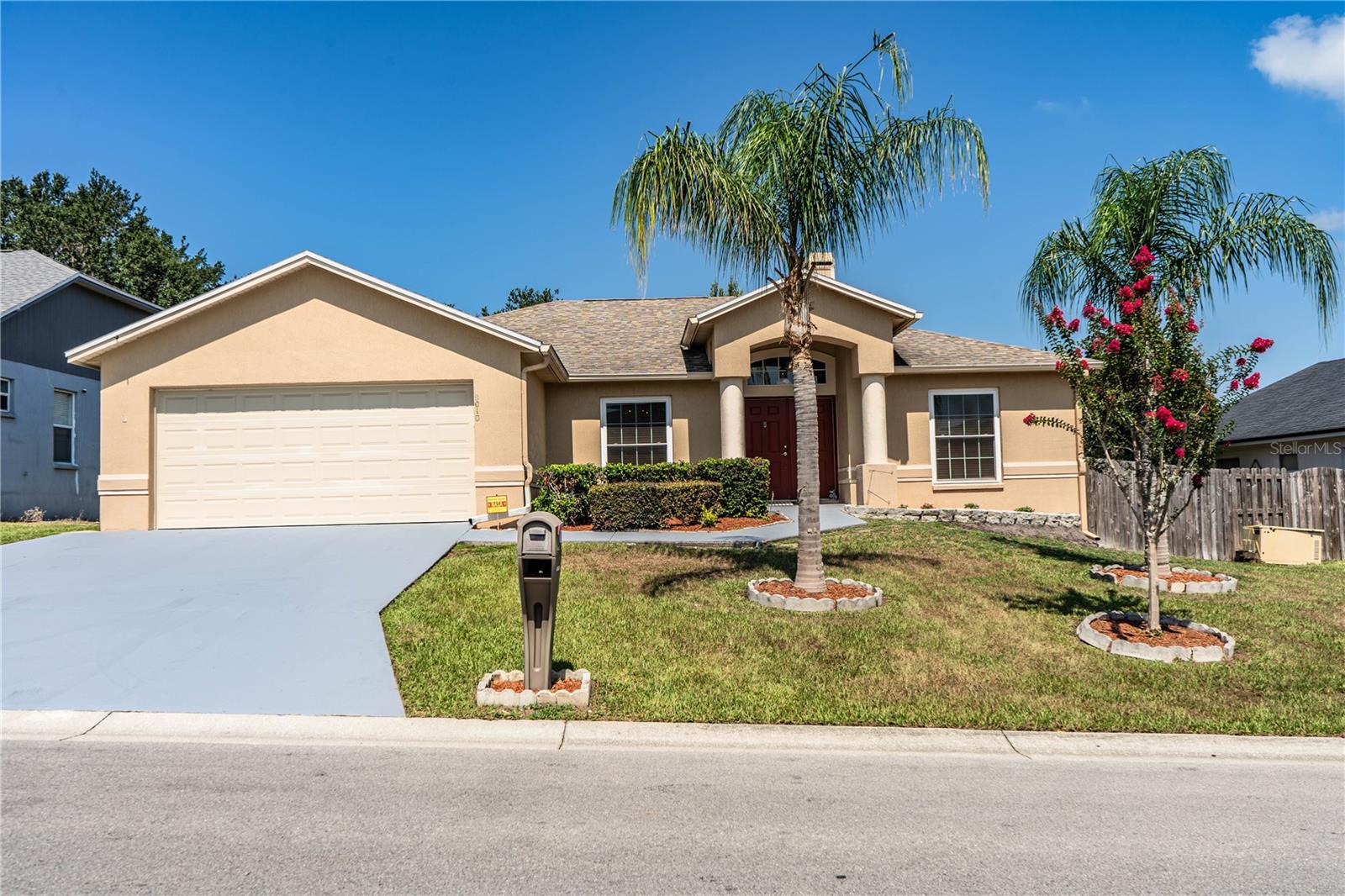 Affordable Northside Ashley Pointe!! 3 BR/2 Bath split plan home with over 1,800 sq. ft. of living area. Perfect for the family, Living Room has high ceilings with a fireplace. Kitchen and Dinette area have luxury vinyl, windows have been updated (2023), New Roof in 2020 and New A/C 2019. Plus, an inside utility room including washer and dryer for your convenience. Move in Ready with nice double garage. Bonus room could be a 4th bedroom (no closet). Screen porch overlooking a large private fenced back yard,  including palm trees, oak trees and contains a shed for storage. The Master Bath is spacious and includes 2 sinks, separate shower and garden tub. All in a convenient location, close to Publix, Lakeland Square Mall, I-4 for easy access to Tampa and Orlando. Don't miss this exceptional value!! Call me today for your private tour!