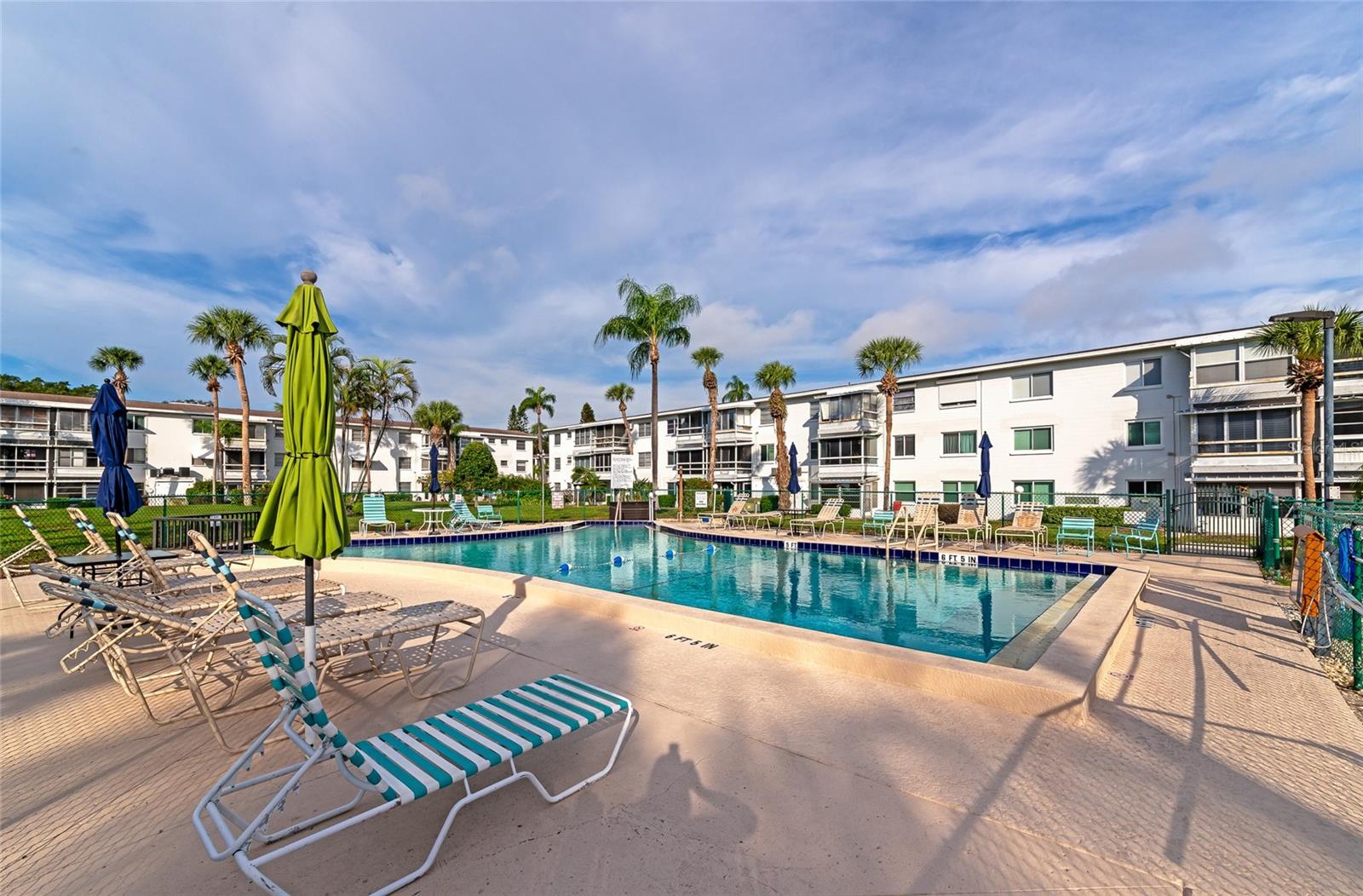 NEW PRICE!  TURNKEY FURNISHED top floor unit!  YES there is an ELEVATOR!  Enjoy the amazing Florida lifestyle at a price you can afford.  One bedroom, one bathroom, and comes with everything you need--just bring your toothbrush!  Low HOA just $246/mo and includes basic cable/internet.  Relaxed living space with a full kitchen, dining, and living room, and a sitting room with a nice view of the courtyard & pool.  Bayshore Condominiums have long been regarded as one of the area's best places to live, and the tradition continues today!  Close to major shopping, dining, the airport, and world-renowned beaches.  Must be 55 or older.  Association does accommodate ESA pets, must apply for approval.  Community pool, shuffleboard, and more.  Wonderful social activities abound, you will love living here--make it yours TODAY!