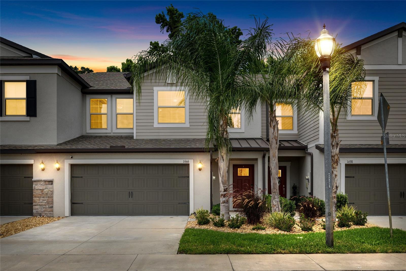 Surrounded by conservation and abundant green space, Willow Square is not your typical townhome community. As you enter through the gates of Willow Square you’ll find a unique floorplan at 1646 Roseville that provides the low-maintenance living of a townhome, but that feels more like a single family home with over 2,200 sqft of living space! What truly sets this home apart is a feature rarely found in townhomes: a spacious first-floor primary suite. Thoughtfully tucked away for privacy, the suite offers direct access to the screened lanai, creating the perfect place to start your mornings with coffee or unwind at the end of the day. You’ll love that the oversized walk-in closet has already been upgraded with custom closet built-ins. Upstairs is where this home will continue to surprise you. With three additional bedrooms, plus a designated office and an expansive loft space, there is room for everyone and everything. The loft even includes a kitchenette complete with a refrigerator and coffee bar, making it ideal for movie nights, overnight guests, or even multi-generational living. Only four years old and meticulously maintained, the owners have already completed upgrades you will appreciate from day one including custom closet systems, gutters, a water softener and overhead garage storage. Elevated finishes throughout the home include crown molding and granite countertops. Located in highly desirable Lutz, you’ll enjoy a setting that feels private, tranquil and far removed from the everyday hustle while still being just minutes from I-275 and the Tampa Premium Outlets. Residents of Willow Square enjoy the security of gated access, a community pool and plentiful guest parking. Here you will find low HOA fees covering the amenities, landscaping, exterior maintenance and roof. As a bonus this community has NO CDD.