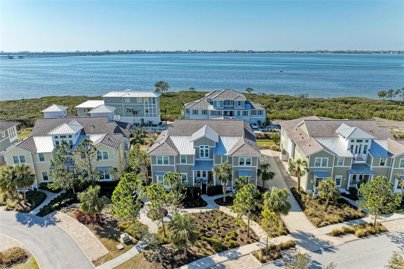 ***WOW, Great Price Improvement***You must see this well appointed, highly sought after, Bimini floor plan home with a large screened lanai and views of sparkling Anna Maria Sound. Live the coastal lifestyle in the prestigious, gated, much sought after resort community of Harbour Isle on Anna Maria Sound. Wow, 2025 NEW HVAC! and NEW Hot Water Heater! This luxury two bedroom/two bath home includes a large den/office (with tile flooring and built-in Murphy bed) that could easily be converted to a third bedroom. This light and bright home features design upgrades throughout — tile flooring, French doors leading to the lanai, crown molding, custom wall treatment in living room, solid wood cabinets, stainless steel appliances, granite countertops, tile backsplash, dining area surrounded by windows with excellent water views, shutters, updated light fixtures, updated guest bath vanity and custom wall design — just to name a few. Walk into the large Primary retreat with partial views to the Intercoastal, shiplap accent wall, a large custom walk-in closet, dual vanities and large shower. In this comfortable coastal home you can end each day with a stunning sunset from your lanai overlooking Anna Maria Sound —featuring custom PGT Eze Breeze Porch Panels and wood-like plank tile floors. The oversized 2-car garage has 12‘ ceilings that allow for overhead storage. The building is strong and built to last including block construction with Hardie board exterior siding and PGT impact rated windows. While inside the gates at Harbour Isle, enjoy the four neighborhood pools with outdoor grills, cabanas, fire pit and kayak launch for the 38-acre lake, and explore two miles of neighborhood walking trails. End the day with an incredible sunset at the 23,000 square foot Beach Club overlooking Anna Maria Sound. The Beach Club features resort-style amenities with the Sky Bar, Lounge, Pavilion, Fitness Center, Yoga Lawn, Event Lawn, resort pool, hot tub and a private beach to launch a kayak in the Sound. Just outside the gates of Harbour Isle you’ll find the Margaritaville inspired Compass Hotel, Safe Harbour Marina and Floridays waterfront restaurant. Cross the Manatee Bridge and you’re on Anna Maria Island with its sugar sand beaches, island charm and over 30 restaurants and shops ready for you to enjoy. The pristine Robinson Preserve is only a mile away where nature and outdoor activities abound. Live your best life and enjoy an active lifestyle in award- winning Harbour Isle. This beautiful home is a must see soon!