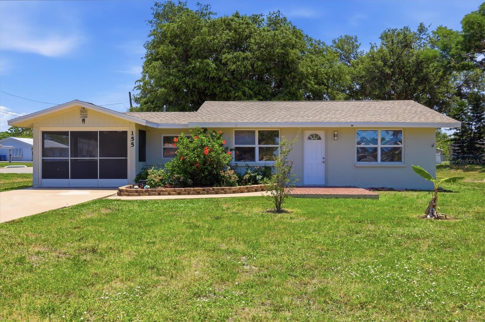 Location, location, location! This beautifully updated corner-lot home offers views of Lemon Bay and the perfect blend of Old Florida charm and coastal living. Relax on your front patio or look out your window as boats cruise by on the Intracoastal Waterway and enjoy spectacular sunset views that make every day feel like a vacation. Thoughtfully updated for peace of mind, the home features a new roof (April 2026), newer A/C, newer electrical panel, newer hot water heater, and a newer storage shed. Inside, you'll find tongue-and-groove wood ceilings throughout, an open-concept floor plan, an updated kitchen with granite countertops, newer lighting and ceiling fans, a separate dining room, and an indoor utility/laundry room. The expansive covered and screened lanai seamlessly extends the living space and can also function as a covered carport, creating the ideal setting for entertaining or simply enjoying Florida's indoor-outdoor lifestyle. Set on a spacious corner lot, the property features two separate driveways providing access from both the front and rear—ideal for guests, extra vehicles, or recreational toys.

Situated just a short stroll from Indian Mound Park, you'll have convenient access to Lemon Bay and the Intracoastal Waterway for boating, fishing, kayaking, paddleboarding, walking, and waterfront picnics. Historic Dearborn Street is only three blocks away, offering boutique shopping, local restaurants, parks, live entertainment, and the popular weekly farmers market.

Whether you're looking for a full-time residence, seasonal getaway, or investment property, this move-in-ready home combines modern updates, timeless coastal character, and an unbeatable location just moments from the water.