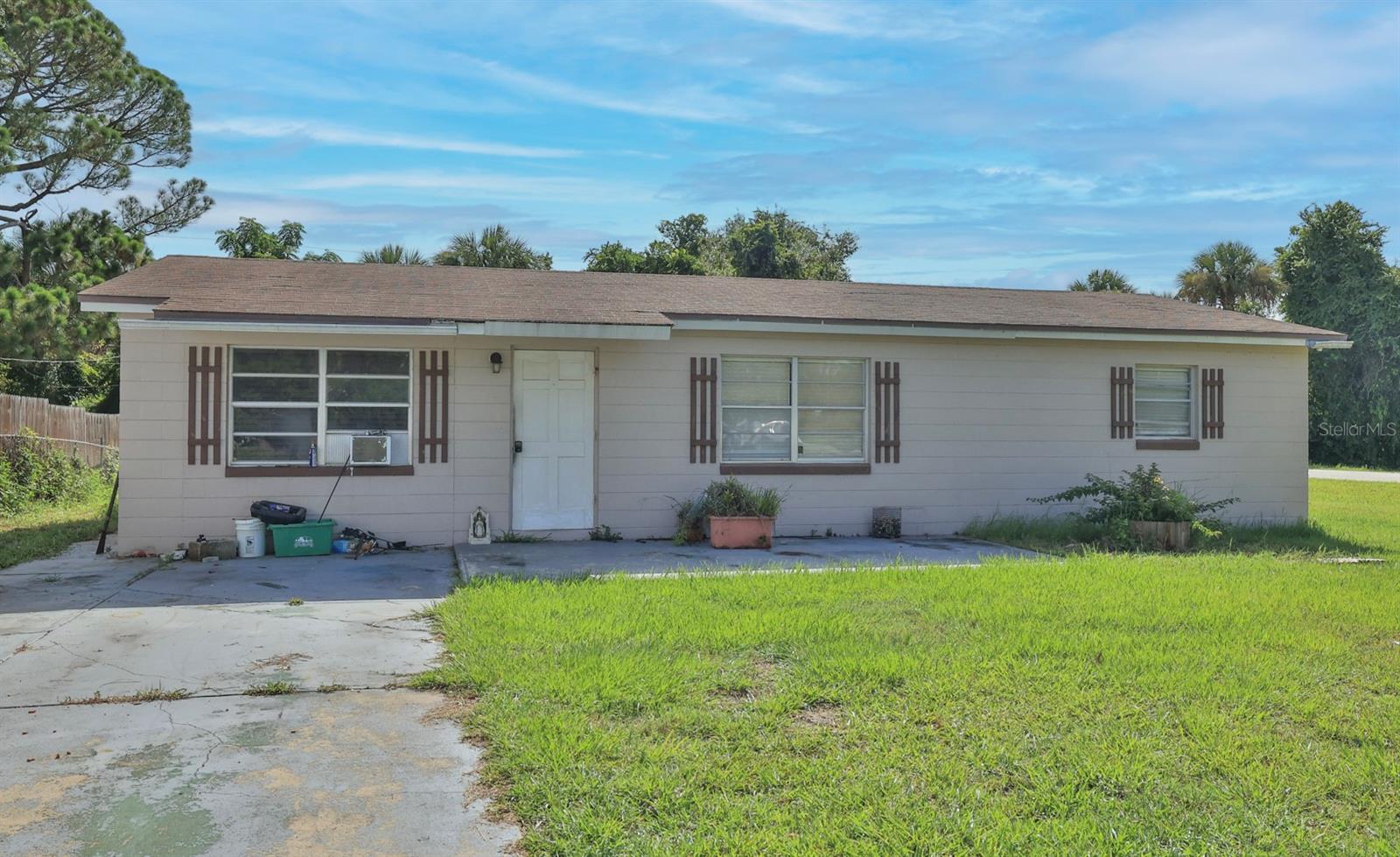 Handyman special priced right and packed with potential! Welcome to 1863 Fern Palm Drive in the established Florida Shores community of Edgewater. This 2-bedroom, 2-bath block home with 1,200 square feet offers an outstanding opportunity for investors, flippers, or buyers looking to renovate and make it their own. Situated on an 80' x 100' lot with no HOA, this property is ready for a complete transformation and provides the perfect canvas to create your vision. The functional single-story layout features a spacious great room, centrally located kitchen, and two comfortable bedrooms, offering a solid foundation for your renovation project. The home is served by public water and sewer, is located in Flood Zone X, and has no minimum lease period, making it an attractive option for both owner-occupants and investors alike. Conveniently located near shopping, dining, parks, schools, US-1, I-95, the Indian River, New Smyrna Beach, and Daytona Beach, this property combines location with exceptional upside. Whether you're searching for your next flip, rental investment, or a home to customize from the ground up, don't miss this opportunity to unlock the potential this property has to offer.
