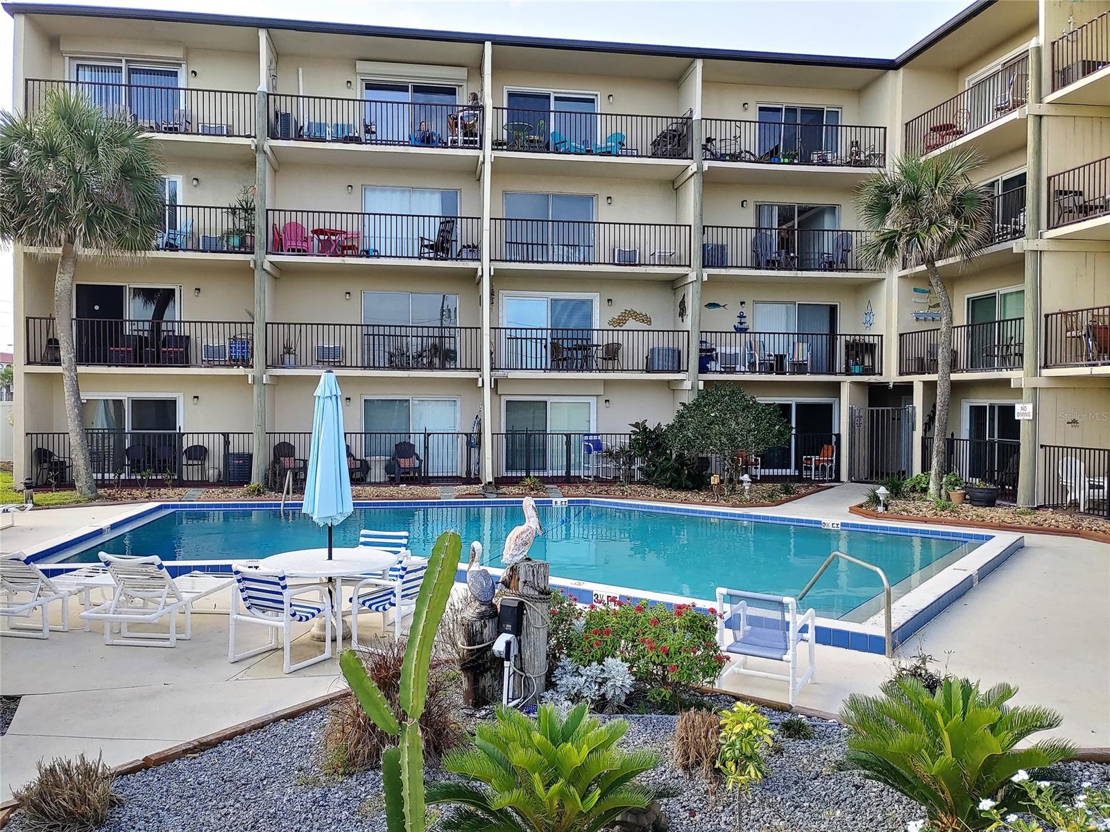 Enjoy your own Beachside Paradise with Awesome Ocean Views all without Ocean Front pricing.  Walk across the street and sink your toes in the sand and frolic in the surf or to the left drive on the beach and park for a while to enjoy all its beauty. To the right enjoy the No Drive Beach and 27th Avenue Park which offers, picnic areas, covered playground, racquet ball and basketball courts. The minute you step into this Beautifully Decorated Studio you will know you have found paradise.  This Updated Studio offers a full Kitchen, Bathroom, Sofa, Dining Table, Murphy Beds and Central A/C.  Step outside on to your private balcony and feel the ocean breezes or enjoy the many colorful Sunrises. From your front door you can enjoy nightly beautiful sunsets.  This Complex offers an elevator, community pool, shuffle board, laundry facility, and charcoal grilling area.  Assigned Parking and plenty of guest parking.  Close to convenience stores, shopping, dining, schools and minutes away from historic Flagler Avenue and Canal Street where dining, shopping and night life are abundant.  New Smyrna is a short drive to Daytona Beach where you can enjoy all of the Bike and Race Week action.  A little over an hour from Orlando and all of the Theme Parks. To the south enjoy rocket launches from your balcony or step down to the beach for a better view with Cape Canaveral about 45 minutes away and to the north St Augustine is only an hour away.  Looking for a great investment this unit has weekly rentals.  Pets are allowed for owners.  This Studio has it all and at an affordable price.  Why not give us a call and Own YOUR Piece of Paradise TODAY!! ;LocationDescription: Condo ;Water: City