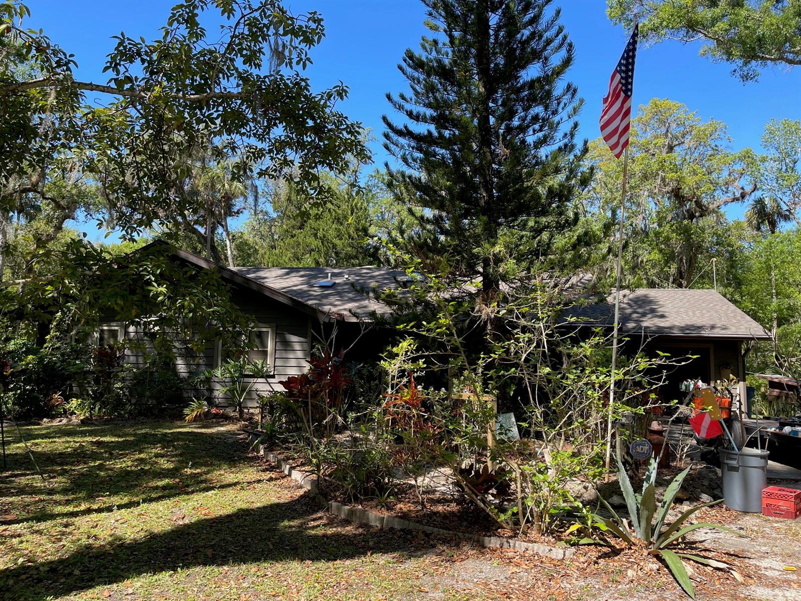 Unique, custom designed and built by original owner.  Enjoy the "country life" yet you're minutes to New Smyrna or Edgewater--shopping, dining, doctor's appointments, the river or beach!  This private escape has a new roof in 2022 and the wood "party deck" overlooking the tranquil pond and woods allows you to enjoy the serenity of the wildlife but still be close to everything you need.  With 2.5 acres, there's also plenty of room for add'l outbuildings and you have room to bring "all the toys"--boats, rv's, 4 wheelers and more!  The wood burning, stone fireplace in the family room is a must see to appreciate.