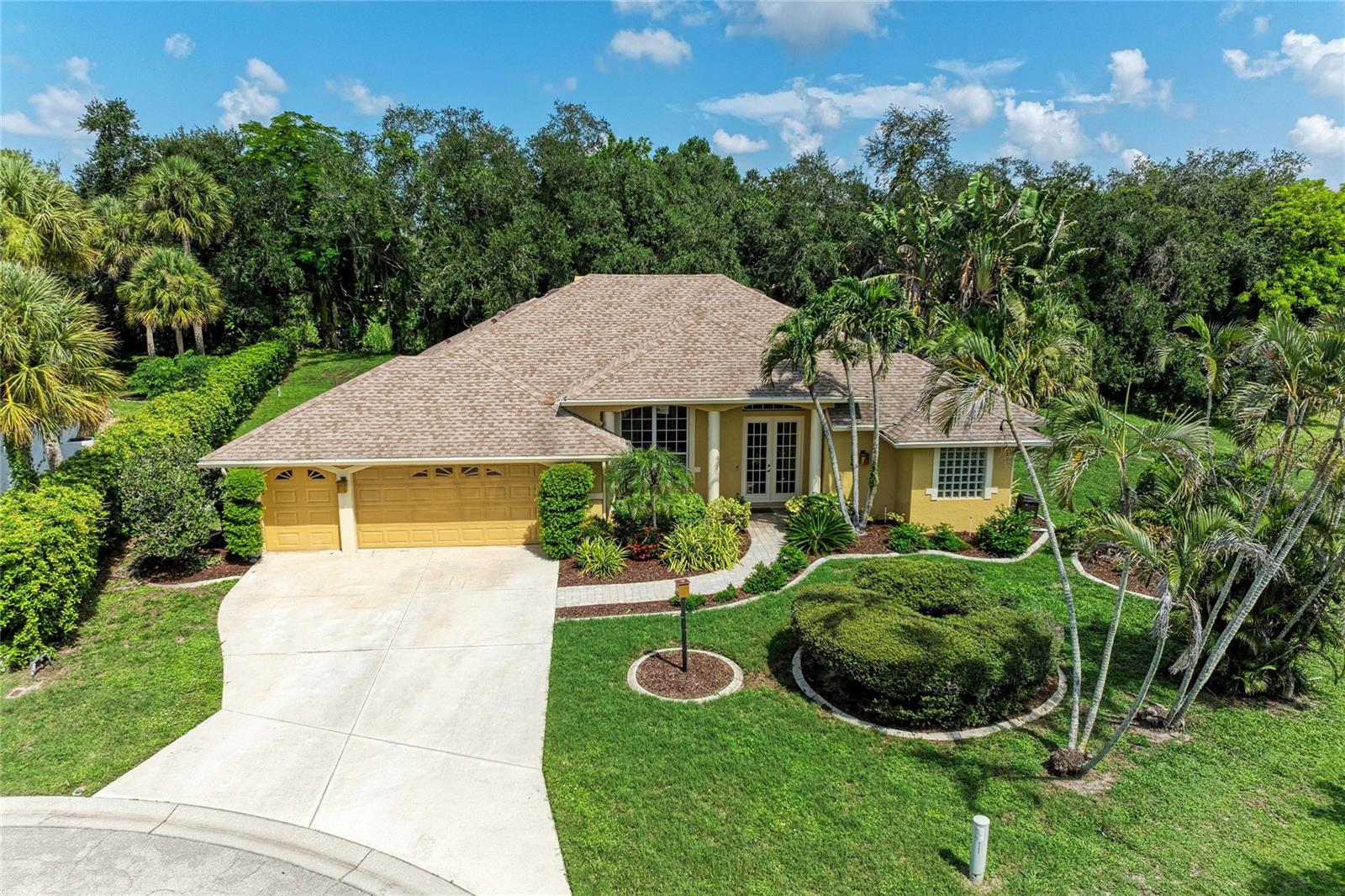 Virtually Staged. Welcome to this beautifully maintained 3-bedroom, 2.5-bath residence, ideally situated at the end of a quiet cul-de-sac in the desirable Otter Creek community, an intimate enclave conveniently located east of I-75 in one of Sarasota's most sought-after locations. Offering the perfect balance of privacy, comfort, and convenience, this exceptional home is designed for effortless Florida living. A thoughtfully designed split-bedroom floor plan provides spacious living areas ideal for both everyday living and entertaining. At the heart of the home is an expansive kitchen featuring abundant cabinetry, granite countertops, stainless steel appliances, and generous prep space, all opening seamlessly to the inviting family room with a cozy fireplace. Formal living and dining rooms provide elegant spaces for hosting family and friends, while the indoor laundry room adds everyday convenience. The spacious primary suite serves as a private retreat, complete with a luxurious en-suite bath featuring dual vanities with granite countertops, a jetted soaking tub, a walk-in shower with dual shower heads, and ample closet space. Two additional bedrooms provide comfortable accommodations for family or guests, while a dedicated home office/den offers the flexibility to work remotely or create a hobby space.  Step outside to your private backyard oasis, where a screened lanai overlooks a sparkling saltwater pool with a tranquil waterfall feature, complemented by an expansive brick paver patio—perfect for relaxing, entertaining, and enjoying Florida's year-round sunshine. The oversized three-car garage provides abundant space for vehicles, storage, and recreational equipment. Recent updates include a new roof (2020), air conditioning system (2019), fresh interior paint, and brand-new carpeting, allowing the next owner to move in with confidence. Enjoy the charm of a peaceful, close-knit community while remaining just minutes from shopping, dining, parks, top-rated schools, and all that Sarasota has to offer. Don't miss this exceptional opportunity to own a beautifully updated home in one of Sarasota's most desirable neighborhoods. Schedule your private showing today!