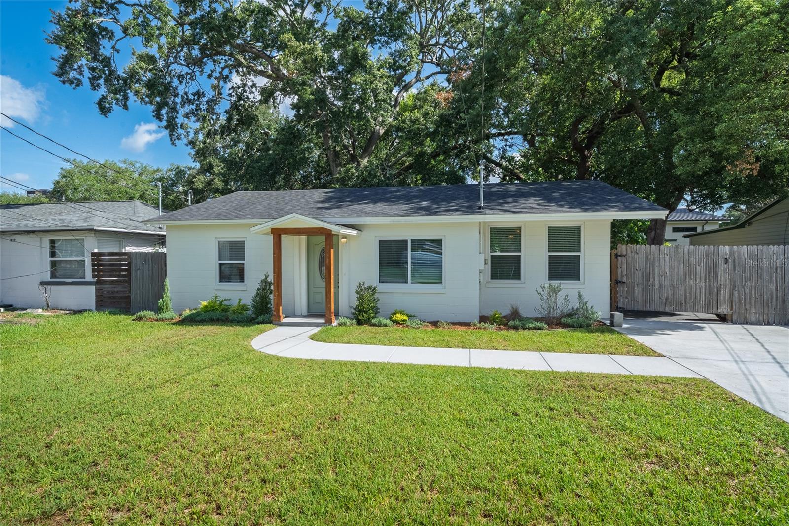 You will not want to miss this charming College Park bungalow! Out front, you will appreciate the updated landscaping and curb appeal along with a new driveway that extends all the way into the backyard for extra parking. Inside, you'll appreciate how fluidly the space flows for entertaining and day-to-day living. The oversized kitchen is at the heart of the home and has was renovated in 2023 to include new cabinets, countertops, and appliances. Two separate living spaces give owners a chance for space to flex as an office, a larger dining room, or just more space to hang out -- each with incredible natural light! Out back, the possibilities are just about endless. There are already beautiful, mature trees and a storage shed for convenience, but it would be a perfect space to add a swing set, a garden, a putting green, or even a pool! There is a shaded outdoor patio, which also serves as incredible outdoor living space for a table, fire pit, or play space. Notable updates and upgrades for insurability and peace of mind: 2022 roof, updated electrical panel, 2024 driveway, 2023 HVAC. In terms of location, it doesn't get much better than this either; 915 Dowd Ave is short walk to Dubsdread Golf Course and the Tap Room at Dubsdread as well as Bishop Moore Catholic High School! There is a septic tank in the backyard, but the City of Orlando has confirmed that public sewer is available for tie-in at this address should the next owner prefer sewer over septic.