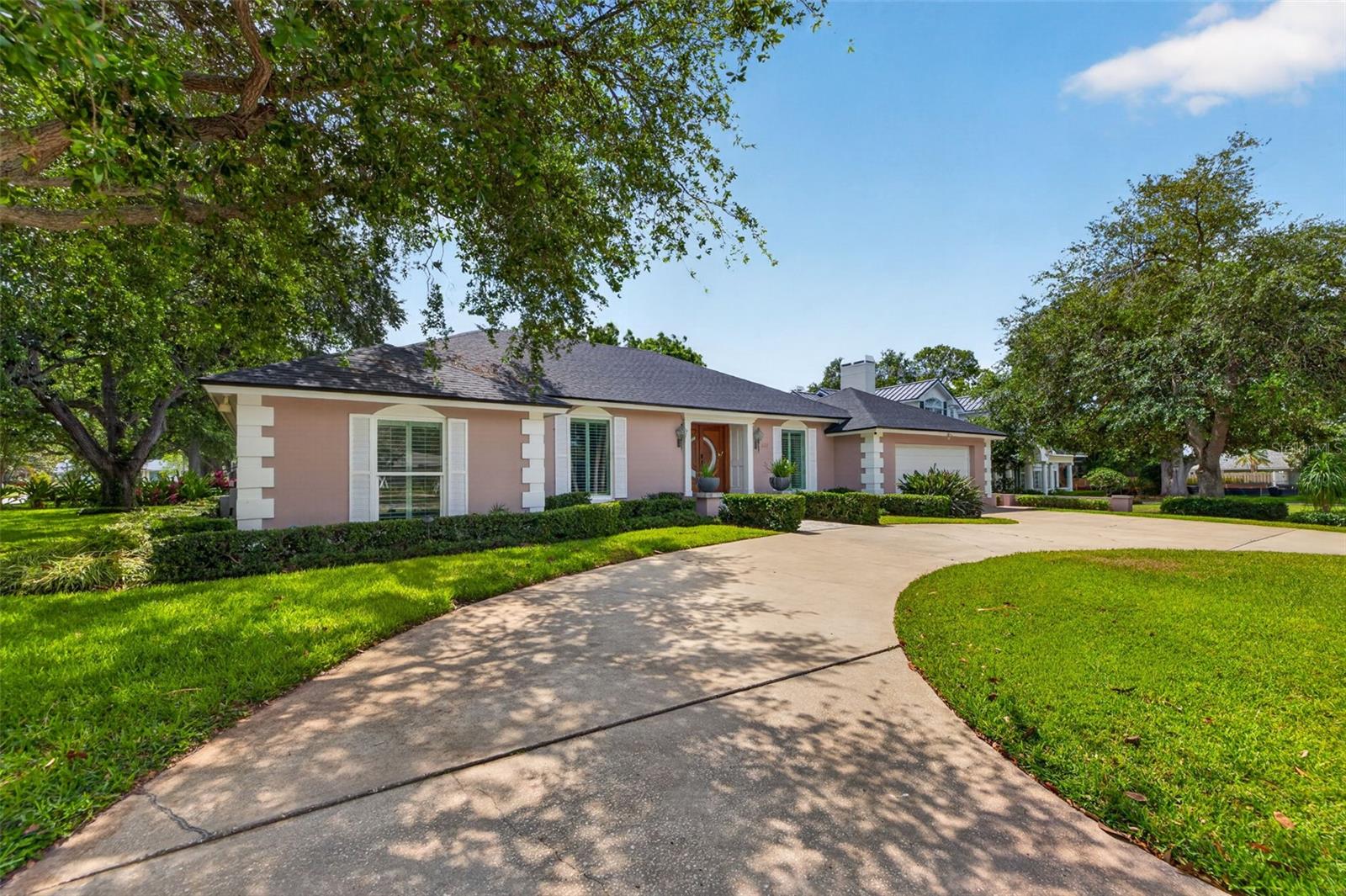 Located on a beautifully landscaped corner lot in Belleair's most prestigious neighborhood, this well maintained four-bedroom, three-bathroom residence offers a rare opportunity to enjoy one of the area's most desirable addresses while creating a home that reflects your own style over time. Situated in a non-flood zone, with a newly installed roof, the property combines peace of mind with exceptional long term value. Inside, approximately 2,415 square feet of living space provide generous room for both everyday living and entertaining. Multiple gathering areas offer flexibility for family life, while the welcoming family room is anchored by a charming wood-burning fireplace, creating a warm and inviting place to relax. The home's comfortable layout has been thoughtfully maintained through the years and offers an outstanding foundation for future enhancements tailored to your personal vision. Step outside to a private backyard where the sparkling pool, spacious patio, and mature landscaping create a private setting for weekend barbecues, family gatherings, or quiet afternoons enjoying Florida's year-round sunshine. The generous corner lot provides both privacy and curb appeal, making a lasting first impression from every angle. Living in Belleair means more than owning a beautiful home. Just minutes away are the Belleair Country Club, Pelican Golf Club, the Belleair Recreation Center, neighborhood parks, boutique shopping, fine dining, Morton Plant Hospital, and the world-famous Gulf beaches. Whether you choose to enjoy the home exactly as it is or gradually personalize the interior to suit your tastes, this exceptional property offers what is becoming increasingly difficult to find in Belleair, a premier location, outstanding condition, and the opportunity to create lasting value in one of Tampa Bay's most sought-after communities.