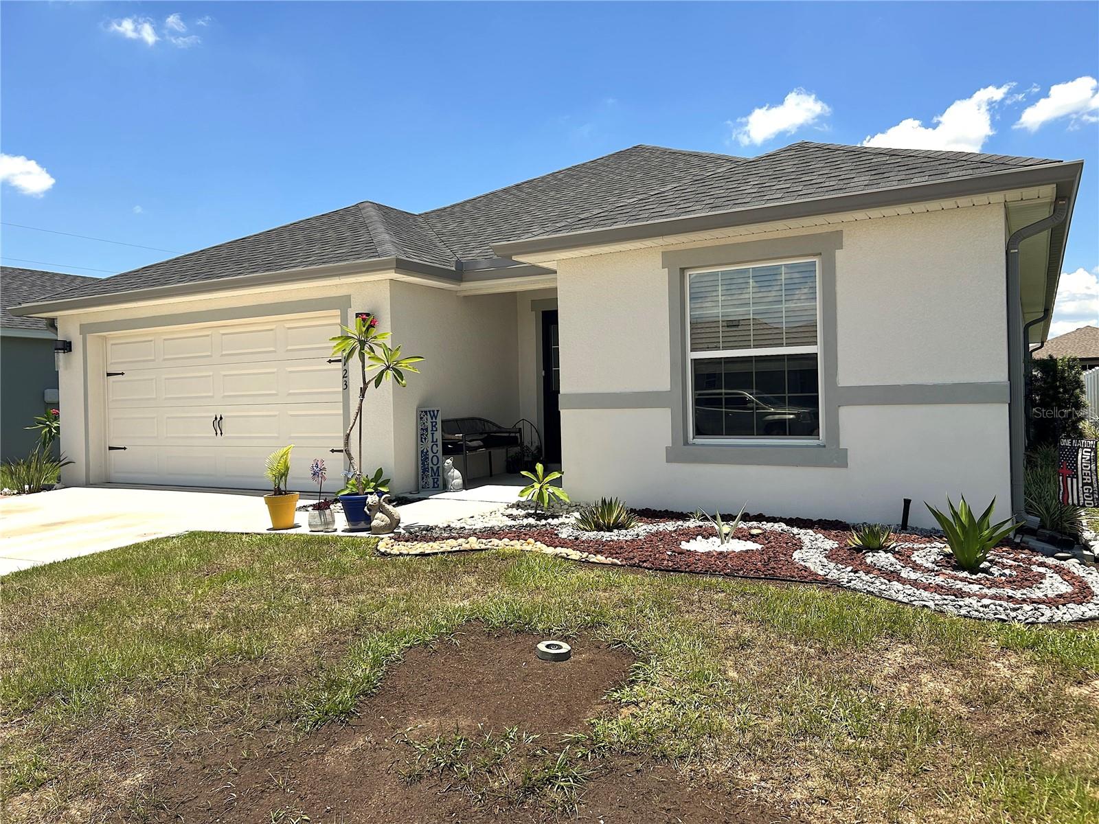 Experience modern living at its finest in this 2022-built single-family home with access to community pool, three mins drive from the home. Thoughtfully designed for comfort and style, this residence features 4 spacious bedrooms, 2.0 bathroom, a dining room, and large open living area with a light-filled floor plan with Luxury vinyl flooring in the main living area.  All Bedrooms are carpeted.  . The spacious living and dining areas flow seamless into a well-appointed kitchen with plenty of storage and prep space. A large screened-in back porch with concrete flooring offers an ideal space for entertaining family and friends while enjoy looking outside. A two car garage, low-maintenance landscaping, and location close to shopping, dining, parks and major road ways make this home a true standout. This home also features solar panels designed to help reduce monthly electric costs. SELLER WILL ASSIST TOWARDS PAYOFF FOR THE SOLAR SYSTEM.  You will enjoy huge savings on electricity.  Don't miss this chance to own this move in ready home. Schedule your showing today.
