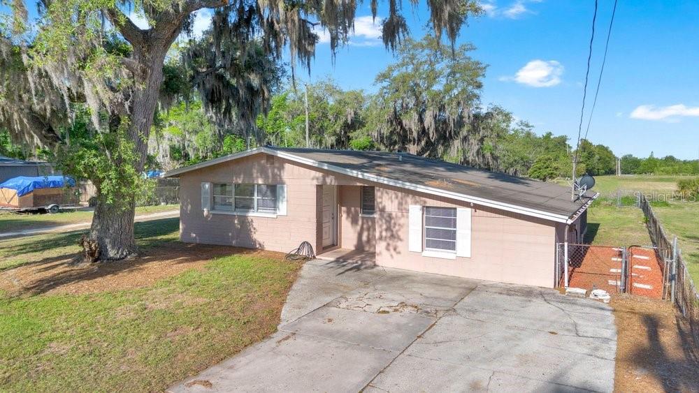 Available for immediate occupancy, this charming 3-bedroom, 1-bath block home offers a spacious lot with no rear neighbors, providing added privacy and a peaceful setting. Inside, you'll find updated flooring in the bedrooms and bathroom, giving the home a fresh and welcoming feel.

The flexible floor plan includes two bonus rooms that can be used as a home office, playroom, hobby space, guest area, or additional storage—offering plenty of options to fit your lifestyle.

Step outside to enjoy the screened lanai, perfect for relaxing, enjoying the Florida weather, or entertaining friends and family year-round. The large yard provides ample outdoor space while maintaining privacy with no rear neighbors.

Conveniently located and move-in ready, this home combines comfort, versatility, and outdoor enjoyment. Schedule your showing today!