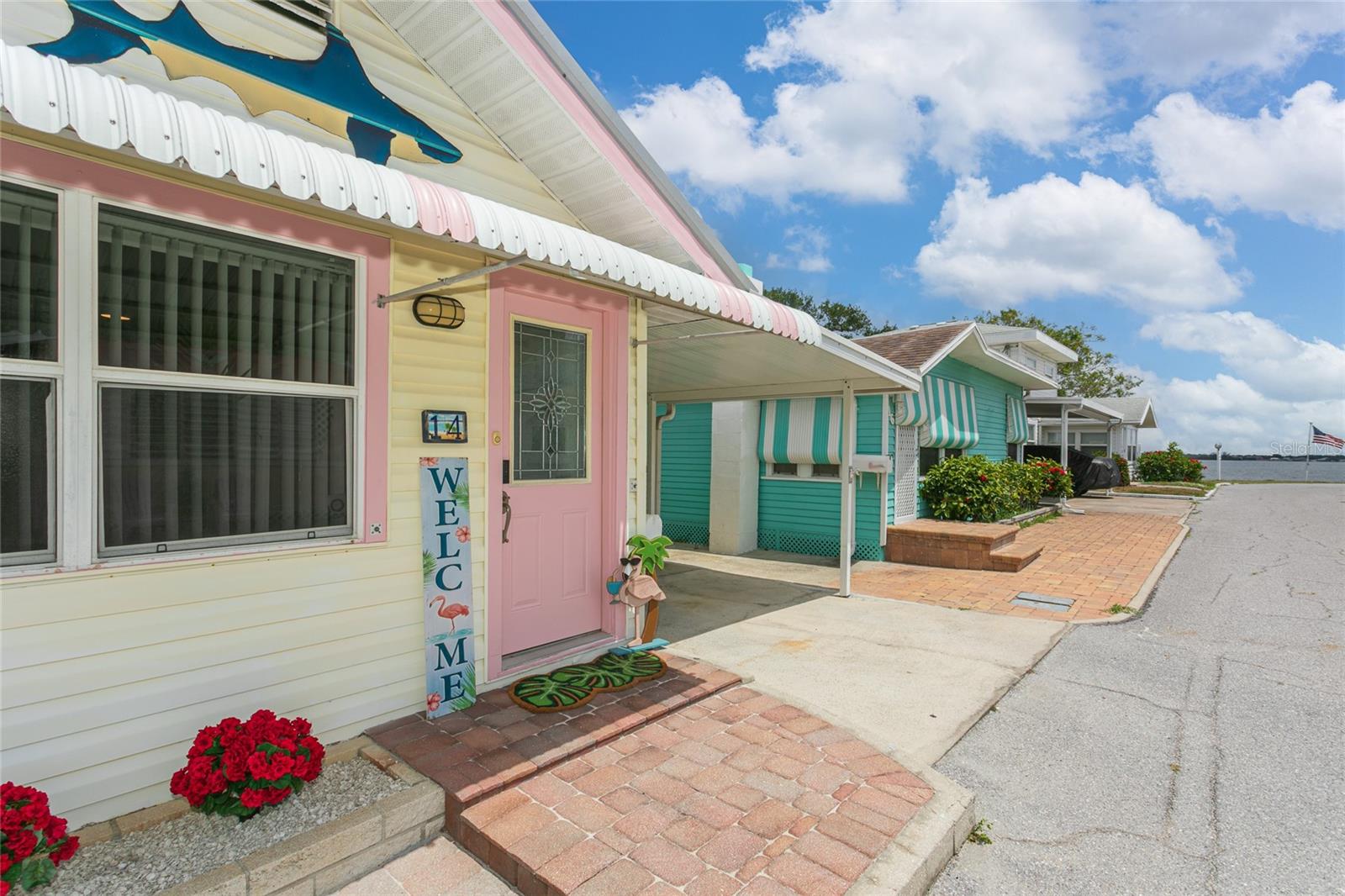 Dreaming of a peaceful waterfront lifestyle just a short drive from the Gulf Coast's most beautiful beaches?  Welcome home to this charming 2-bedroom, 1.5-bath residence nestled in a quaint and historic 55+ community, located only 12 miles from Anna Maria Island. This unique home is one of only five homes in this community with this special private waterway behind their property (198 homes in the community).   This inviting home offers a rare combination of privacy and tranquility, featuring a secluded rear retreat with a serene freshwater stream and depending upon the tide level there is a small waterfall to enjoy from your deck.  Relax on your private deck, complete with a versatile hot tub that's perfect for soothing soaks during cooler months and refreshing dips during the summer.  Just four houses away from the large waterway where the Braden River empties into the Manatee River.  A beautiful sight daytime and during sunsets. Inside, you'll find a spacious living room with a great water view from one window.  There is a generously sized eat-in kitchen, providing comfortable spaces for everyday living and entertaining. Both bedrooms have good closet space. The home has been thoughtfully updated with a metal roof in 2020, HVAC system in 2024, whole house water filtration system, replacement of the main water supply line from the meter to the home and luxury vinyl plank flooring--offering peace of mind and modern comfort. Outside, convenience abounds with an extended carport on one side of the home and a dedicated covered golf cart parking on the other, along with a screened porch ideal for enjoying Florida's beautiful weather year-round. The community itself is a hidden gem, featuring a large 700 ft long fishing pier with a cleaning station.  This seller says he has caught some amazing fish here.  There are boat docks to accomodate approximately 40 boats and a welcoming atmosphere. Even better, the annual HOA fee is only $400 and boat dock rentals are available for just $300 year. Amenities for Park Residents include a boat launching ramp, wet docks and dry docs are available.  Residents enjoy an active social calendar during the seasonal months. Ammenities include: A community center (which can be rented out by residents for gatherings), A cottage is available to rent for $65 a night for your overflow of guests when needed and an RV parking area. There is a Men's Clubhouse, Ladies Clubhouse and Shuffleboard Courts making it easy to meet neighbors and stay engaged. Whether you're seeking a year-round residence, seasonal getaway, or retirement retreat, this charming property offers exceptional value, natural beauty, and an unbeatable Florida lifestyle.