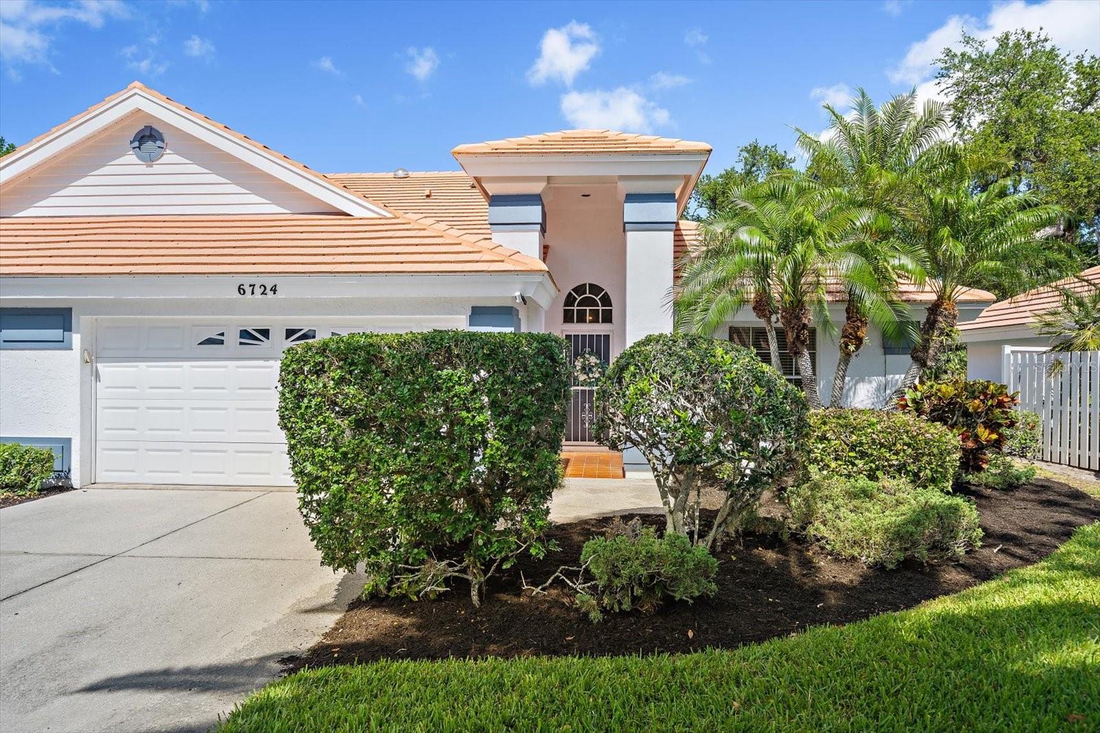 Virtually Staged. Tucked away at the end of a quiet, tree-lined drive lies Westwoods II—a hidden Sarasota enclave of just 42 residences where life moves at a more peaceful pace. As you arrive, you immediately sense the privacy and charm that make this community so special, and within it, a rarely available 2-bedroom, 2-bath villa-style condo invites you to imagine your next chapter.  Step inside and feel the openness of the vaulted ceilings as natural light pours in from skylights above, illuminating a thoughtfully designed 1,673 sq. ft. floor plan. The layout flows effortlessly, with a step-down great room that creates a warm, inviting focal point for gathering, relaxing, or entertaining. Just beyond, a screened-in patio opens to a secluded, lush backyard, offering the perfect backdrop for morning coffee or quiet evenings.  At the heart of the home, the kitchen blends style and function with sleek black granite countertops, a stone backsplash, tile flooring, and a cozy dine-in space that connects seamlessly to the dining area. French doors lead you into the living space, where every corner feels both spacious and welcoming.  The primary suite is a true retreat—generously sized, featuring a walk-in closet and a large window overlooking a tranquil, garden-like setting. The ensuite bath offers spa-like comfort with dual vanities, a jetted soaking tub, and a separate shower. A cleverly designed pocket door creates a private guest wing, transforming the second bedroom and bath into its own secluded suite—ideal for visitors or multi-generational living.  Beyond the walls of the home, Westwoods II offers a lifestyle of ease and convenience with maintenance-free living, a community pool, private roads, exterior care, exterior pest control, cable, and low condo fees—allowing you to spend less time on upkeep and more time enjoying everything Sarasota has to offer.  Perfectly positioned just minutes from Palmer Ranch, I-75, and Clark Road, you’re never far from beaches, dining, shopping, and the vibrant Suncoast lifestyle.  This isn’t just a home- it is a place to unwind, entertain, and truly enjoy where you live. Experience the charm of Westwoods II and make it your own.