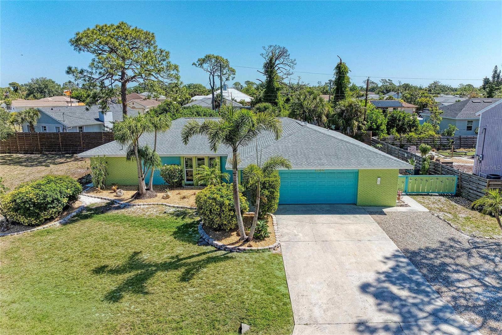 Experience timeless elegance and relaxed coastal living in this beautifully appointed South Venice residence, ideally positioned on a spacious corner homesite just steps from South Venice Lemon Bay Preserve and five minutes from Manasota Key Beach. Offering privacy, serenity, and no HOA or Deed restrictions, this home embodies the essence of effortless Florida living. Designed for both comfort and style, the interior showcases a thoughtfully curated layout with multiple living spaces, including a welcoming family room with custom built-in cabinetry, a refined dining area with integrated millwork, and a cozy wood-burning fireplace that serves as a warm focal point. The fully renovated kitchen (2022) features granite countertops, crisp white cabinetry, and stainless steel appliances, complemented by seamless luxury vinyl plank flooring throughout the home.
Step outside to your private retreat—an expansive west-facing Florida Room with spa, enhanced by a custom tiled floor and offering breathtaking sunset views over the preserve. Surrounded by lush, mature, and drought-tolerant landscaping, the enclosed backyard provides both beauty and privacy, with ample space to design a custom pool (plans and elevation certificate available).
Function meets flexibility with abundant storage throughout, a generously sized laundry/mud room with utility sink, and an oversized two-car garage with workspace and built-in storage. The property also caters to an active lifestyle, with extensive parking capacity for multiple vehicles, boats, or recreational equipment.  Recent upgrades—including a newer roof (2019), and impact-rated windows and doors—offers peace of mind and modern convenience. Perfectly located near the South Venice Ferry and Shamrock Park, with optional access to the South Venice Community Center, residents enjoy proximity to private beach access, boating, and scenic trails. A rare opportunity to own a refined yet relaxed retreat in one of Venice’s most desirable coastal enclaves—where space, style, and sunset views come together in perfect harmony.