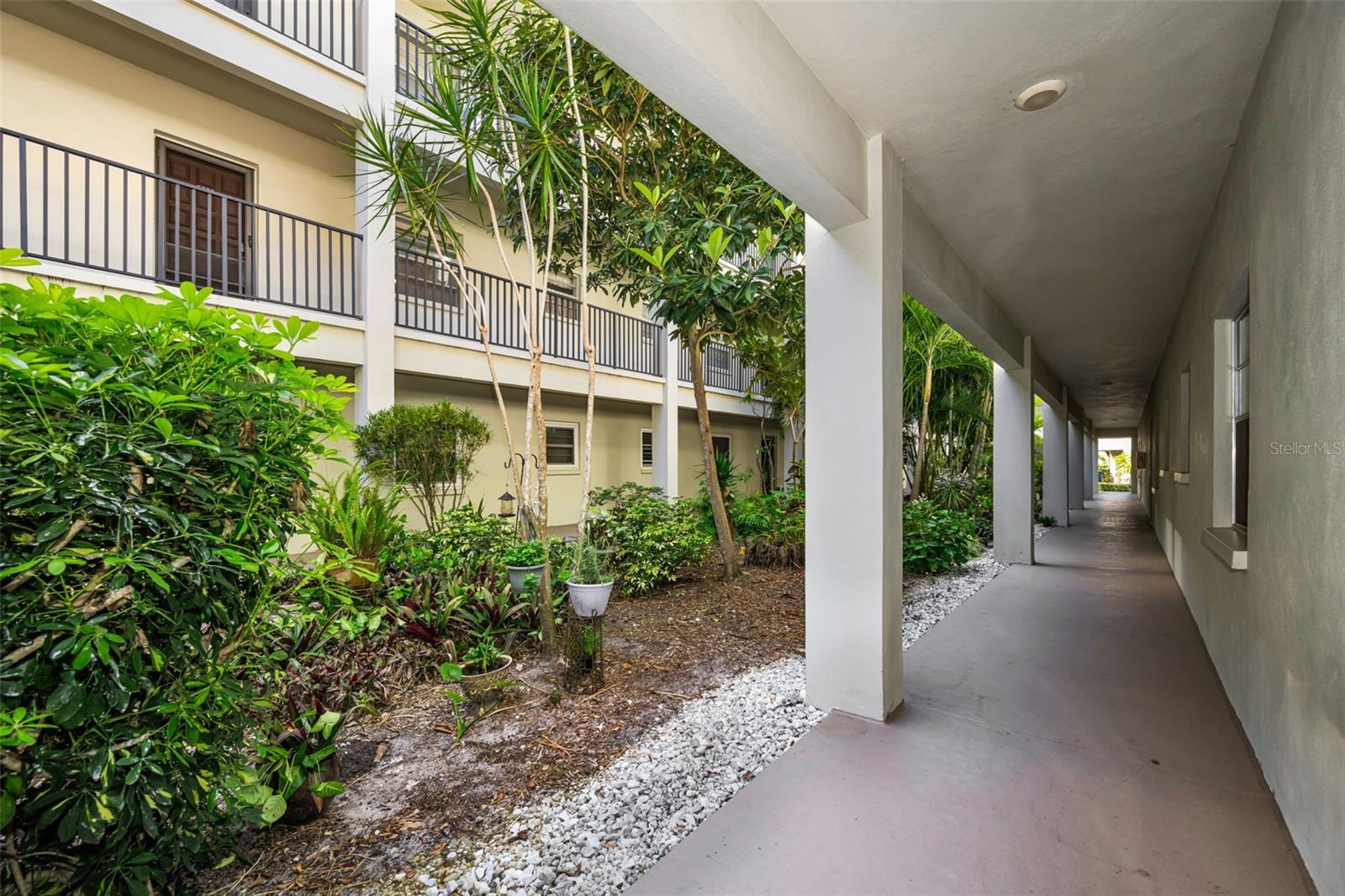 Your Dunedin Getaway! 2BR/1.5 Bath ground floor unit is EASY  for pets and groceries! Clean, comfortable and nicely furnished, with a living room view toward the pond/fountain. Mostly all tile floors, open layout with dining room and kitchen windows that look out to the tropical atrium area. Bldg located right across from the community waterfront park/ kayak racks and beach, complete with BBQ grills and tables- what a great place to watch the sunsets! ON-SITE clubhouse, fitness center, rec bldg, tennis/pickleball, heated pool +++, and across the street from the Pinellas Bike Trail. 1 Block to Publix, Walgreens, deli, restaurants and more. Room sizes approximate, small pet to 25lbs OK.