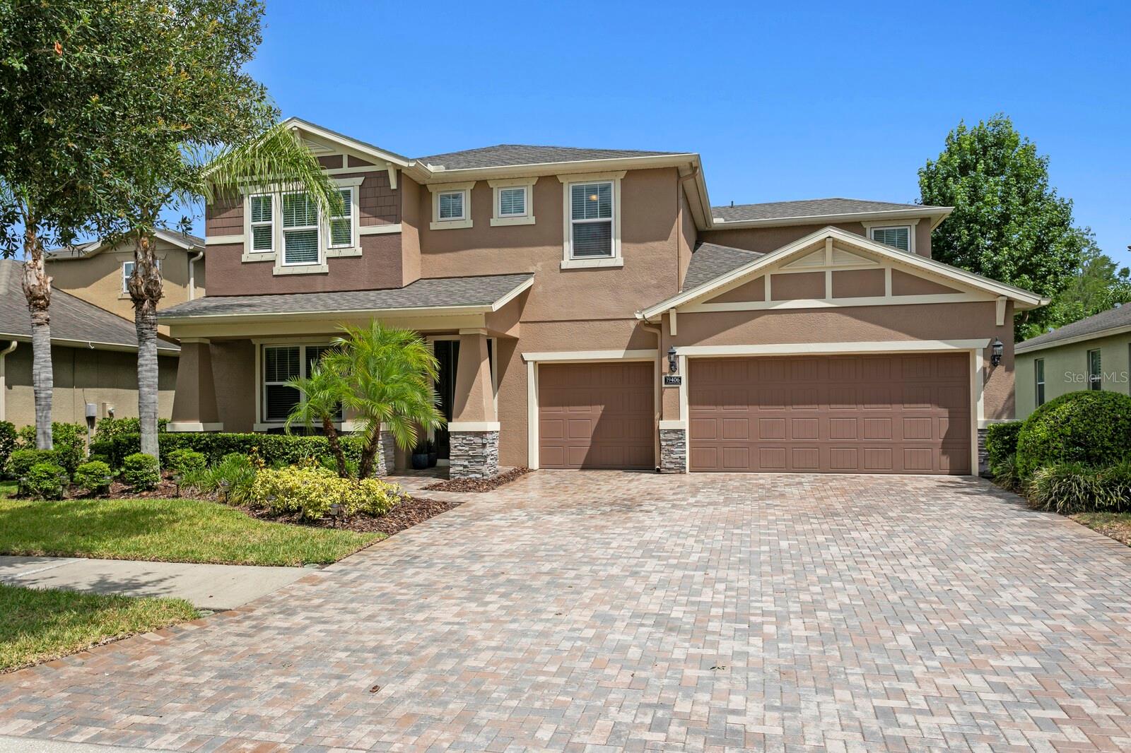 If you’ve been searching for a large pool home w/all of the expensive updates completed, then look no further!  Welcome home to this gorgeous 2013 home in the highly sought after gated Waterbridge section of Stonebrier in beautiful Lutz, FL.  Located on a fantastic conservation lot w/no front or rear neighbors, this home is zoned for one of Hillsborough county’s premier school districts – all A-rated schools (McKitrick/Martinez/Steinbrenner)! With over 3,300sqft of living space, this home features 4 bedrooms, 3 ½ baths, a private office/den & huge bonus room! As you enter the sprawling brick paver driveway, you’ll find a NEW dimensional shingle roof (fully transferrable warranty) & fantastic curb appeal w/carefully manicured landscaping beds surrounded by decorative concrete curbing.  Enter the spacious foyer through the glass front door and you’ll find crown molding, hand-scraped hardwood floors & French doors that open to a private home office.  Beyond the office is the formal dining room.  Further down the foyer, the large family room features surround sound, terrific natural lighting & an open concept floor plan.  Adjacent to the family room is the gourmet kitchen that includes 42” wood cabinets, granite counters, tiled backsplash, stainless appliances including a convection oven w/air fryer, French door refrigerator & reverse osmosis water filter.  The large island also has a breakfast bar plus additional seating at the casual dinette space w/fantastic backyard views & sliding door access to the pool.  Step outside to the nearly 1,100sqft lanai where you'll relax under the covered portion of the lanai, with additional shade offered by a powered Sunsetter retractable awning.  The travertine pool deck is simply stunning, surrounding the custom PebbleTec saltwater pool & propane heated spillover spa, all under the recently re-screened pool cage.  Back inside is a large inside utility room w/custom cabinets & utility sink plus access to the oversized 3-car garage.  Adjacent to the laundry is the updated 1st floor half bath.  The 1st floor primary suite includes new luxury vinyl plank flooring, plantation shutters, direct access to the pool/lanai & dual walk-in-closets.  The primary bath includes a large garden tub, oversized, frameless shower, dual vanities w/granite counters & a make-up area.  Head up the split staircase to the 2nd floor & you’ll find a large bonus room that can easily be converted into a 5th bedroom if needed.  The 2nd and 3rd bedroom share the 2nd full bath, complete w/dual sinks & a tub/shower combo.  The 2nd bedroom also has a custom Murphy bed, so it’s the perfect space for overnight guests.  The 4th bedroom has a full ensuite bath including a tub/shower combo.  Additional upgrades include a NEW shingle roof (2026), NEW water heater (2026), updated HVAC systems (2024/25), hurricane shutters, generator transfer station (portable generator included), water softener, ceiling fans, garage overhead storage racks, custom closet organizer systems & more!  Enjoy resort quality community amenities including a zero-depth pool w/splash area, waterslide, poolside cabanas & lounge chairs, playground & 24-hr fitness center. Stonebrier also features community basketball, soccer & cricket fields along w/lots of lakes, ponds & conservation views. Don’t miss out on the opportunity to make this beautiful home yours today!