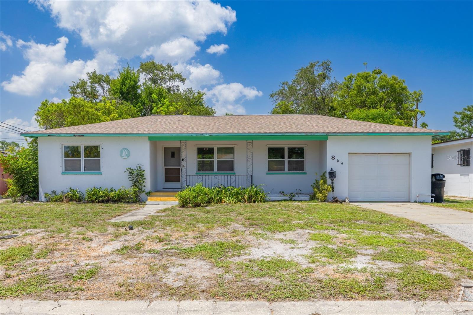 **MULTIPLE OFFERS - HIGHEST AND BEST OFFERS DUE BY NOON on 7/14/26 and Seller will issue response on 7/15/26**Prime Investment Opportunity or Perfect Starter Home! Peace of mind comes standard with this solid, BLOCK-construction gem situated HIGH and DRY in Flood Zone X (no flood insurance required!) and Evacuation Zone D. This property features 2 spacious bedrooms, both with step-in closets,  1 bath, and beautiful original hardwood floors throughout most of the home. The large kitchen offers plenty of eat-in space, while the attached 1-car garage includes laundry hookups and the ideal footprint for a second half-bath. Step outside to your massive, 9,400+ SqFt lot—a rare find with more than enough ROOM FOR A POOL, an ADU, or your dream backyard oasis! Location is everything: Minutes to the world-class Gulf Beaches and bustling Downtown St. Pete. Easy, quick access to I-275 for effortless commuting. Leisure is at your doorstep with Boyd Hill Nature Preserve, Lake Maggiore, Lake Vista Park, and Lakewood High School just moments away. Whether you are looking to add a high-performing rental to your portfolio, flip, or customize your own personal haven, this property offers endless potential.